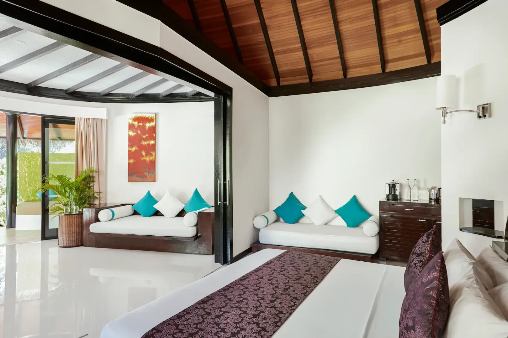 luxury pool beach villa bed view at sun siyam iru fushi maldives private beachfront accommodation