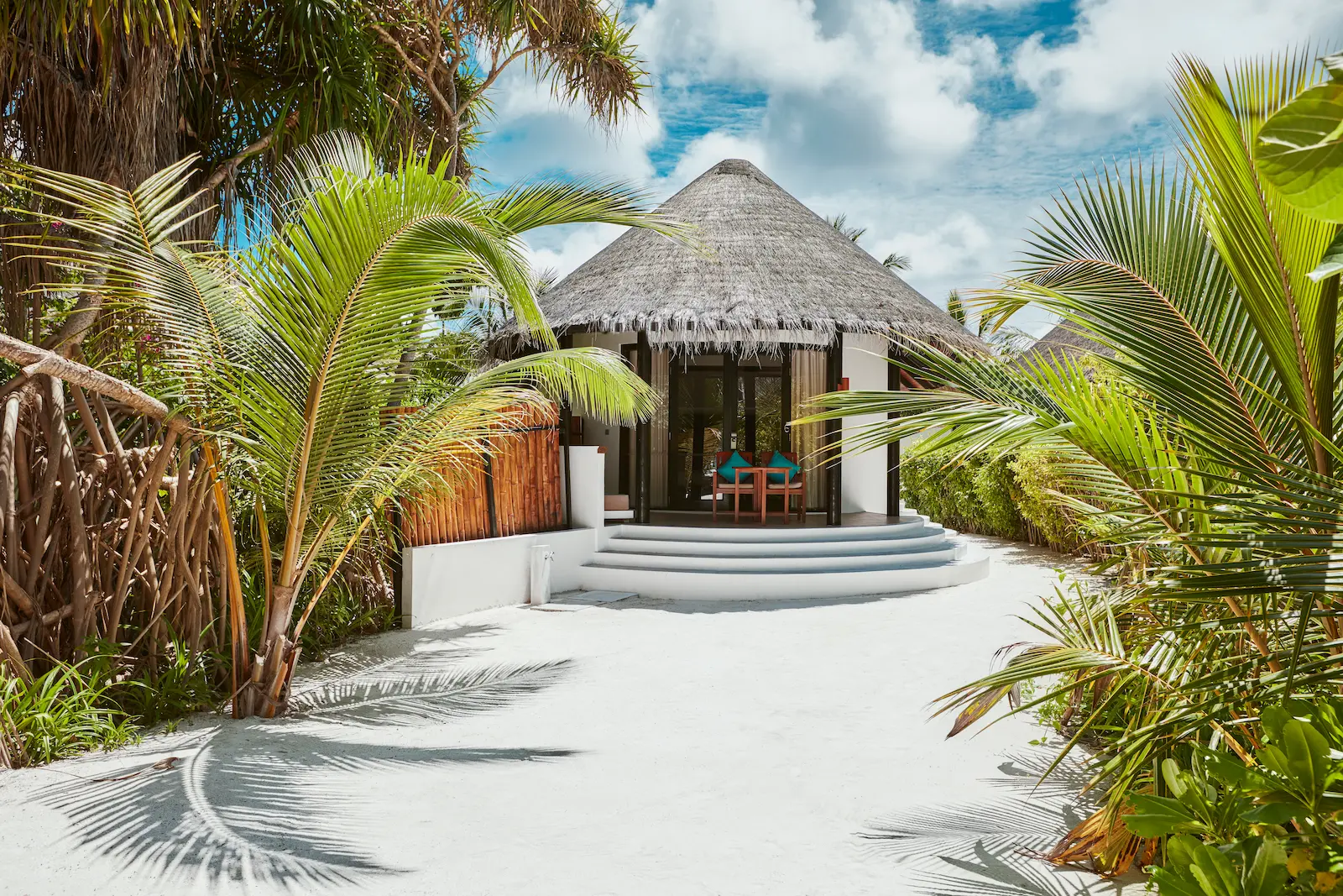 luxury pool beach villa exterior at sun siyam iru fushi maldives private beachfront accommodation