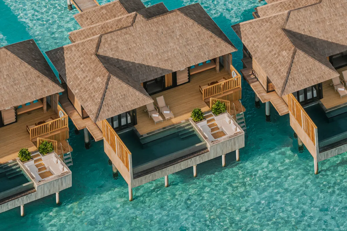 luxury sunset horizon water villa with pool aerial view at sun siyam iru fushi maldives overwater accommodation