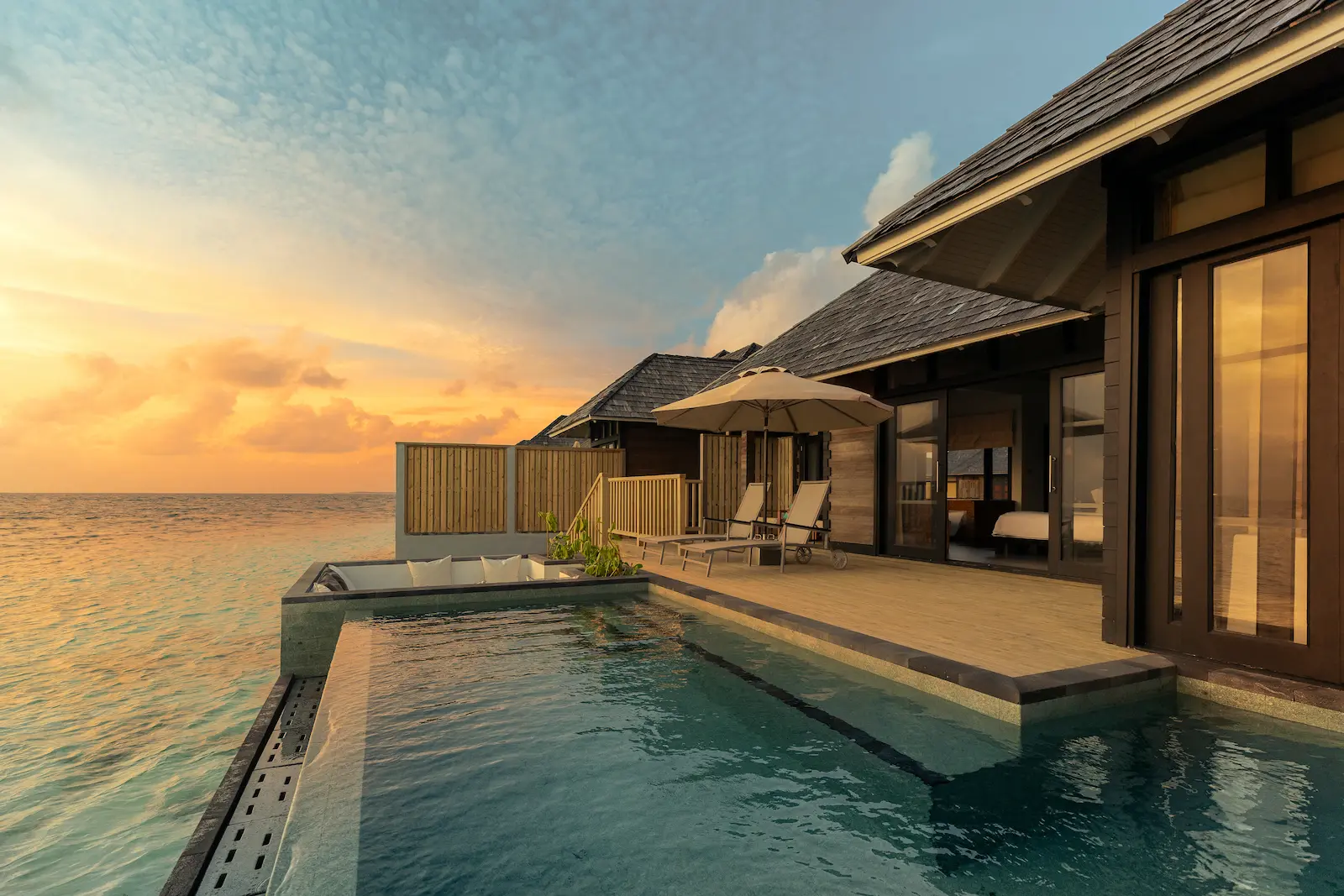 luxury sunset horizon water villa with pool sunset view at sun siyam iru fushi maldives overwater accommodation