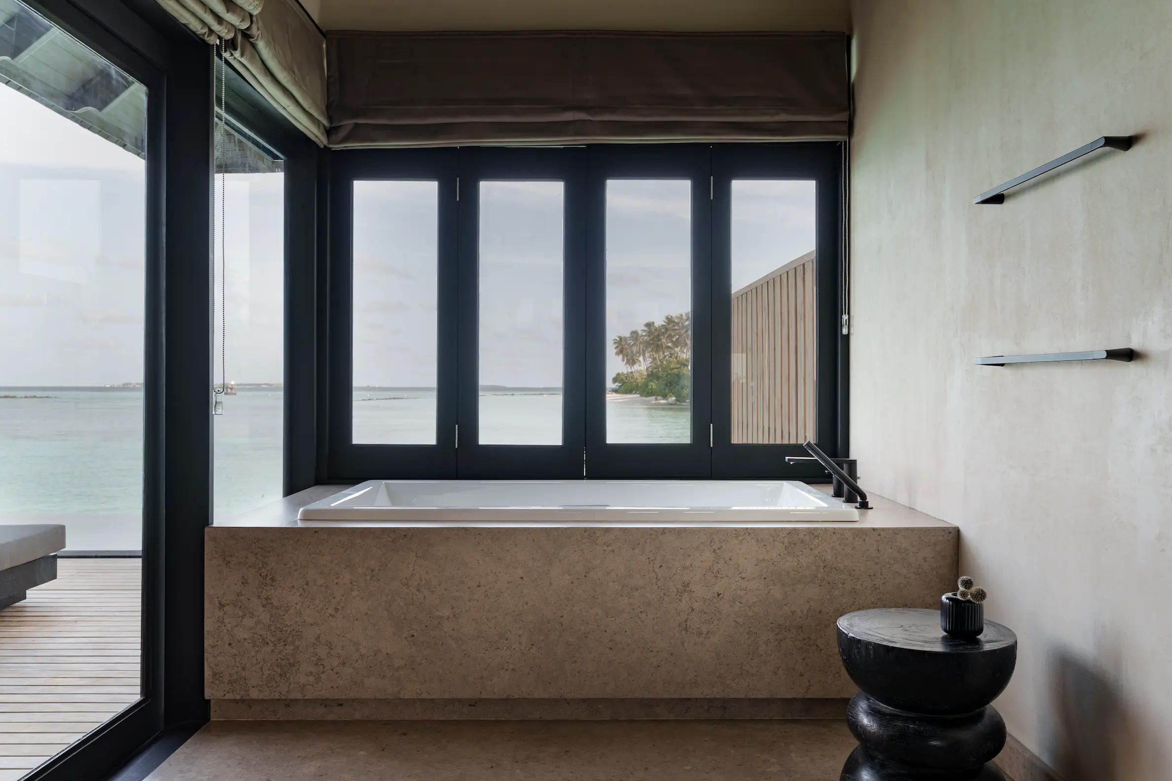 luxury water villa with pool bathtub at sun siyam iru fushi maldives overwater accommodation