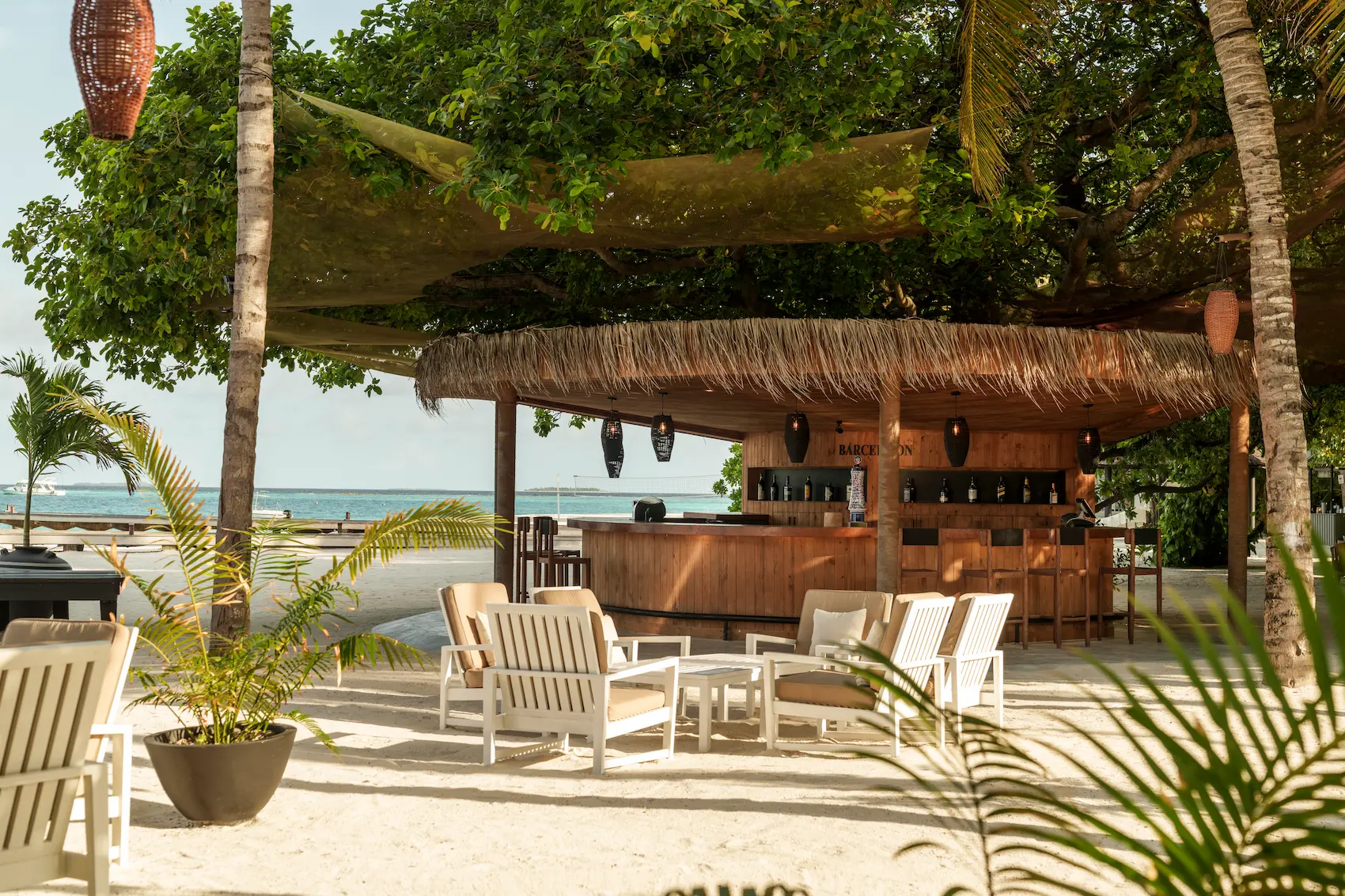 luxury waters edge and bar reception exterior at sun siyam iru fushi maldives island arrival and dining experience
