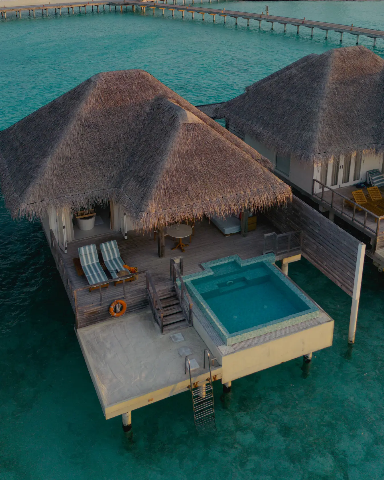 sun siyam iru veli dolphin ocean villa with pool overwater exterior maldives