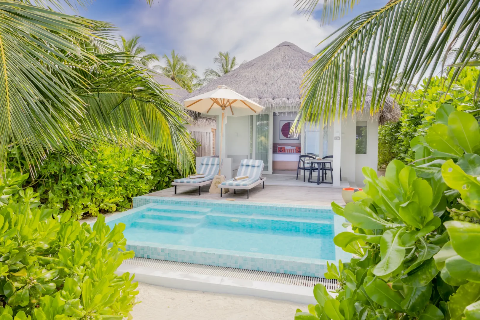 sun siyam iru veli maldives beach villa with pool exterior showcasing private terrace lush tropical greenery and direct beach setting