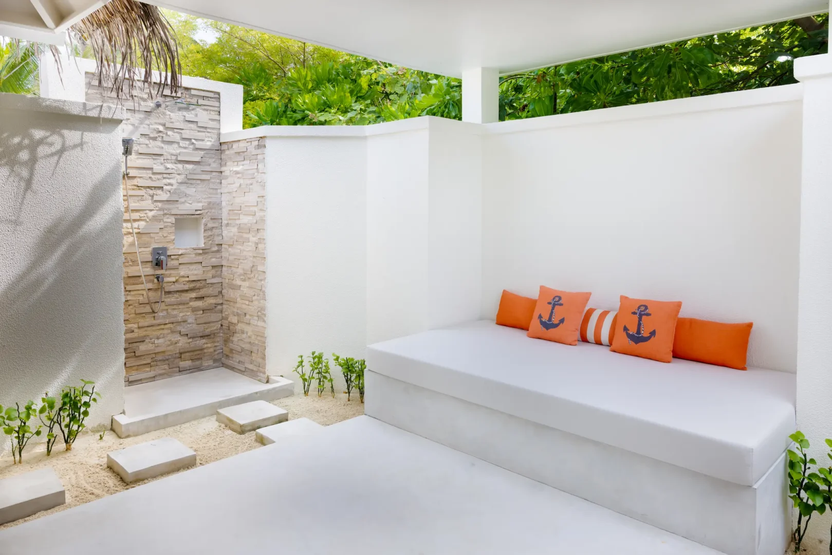 sun siyam iru veli maldives beach villa with pool shower featuring open air design natural stone finishes and tropical privacy