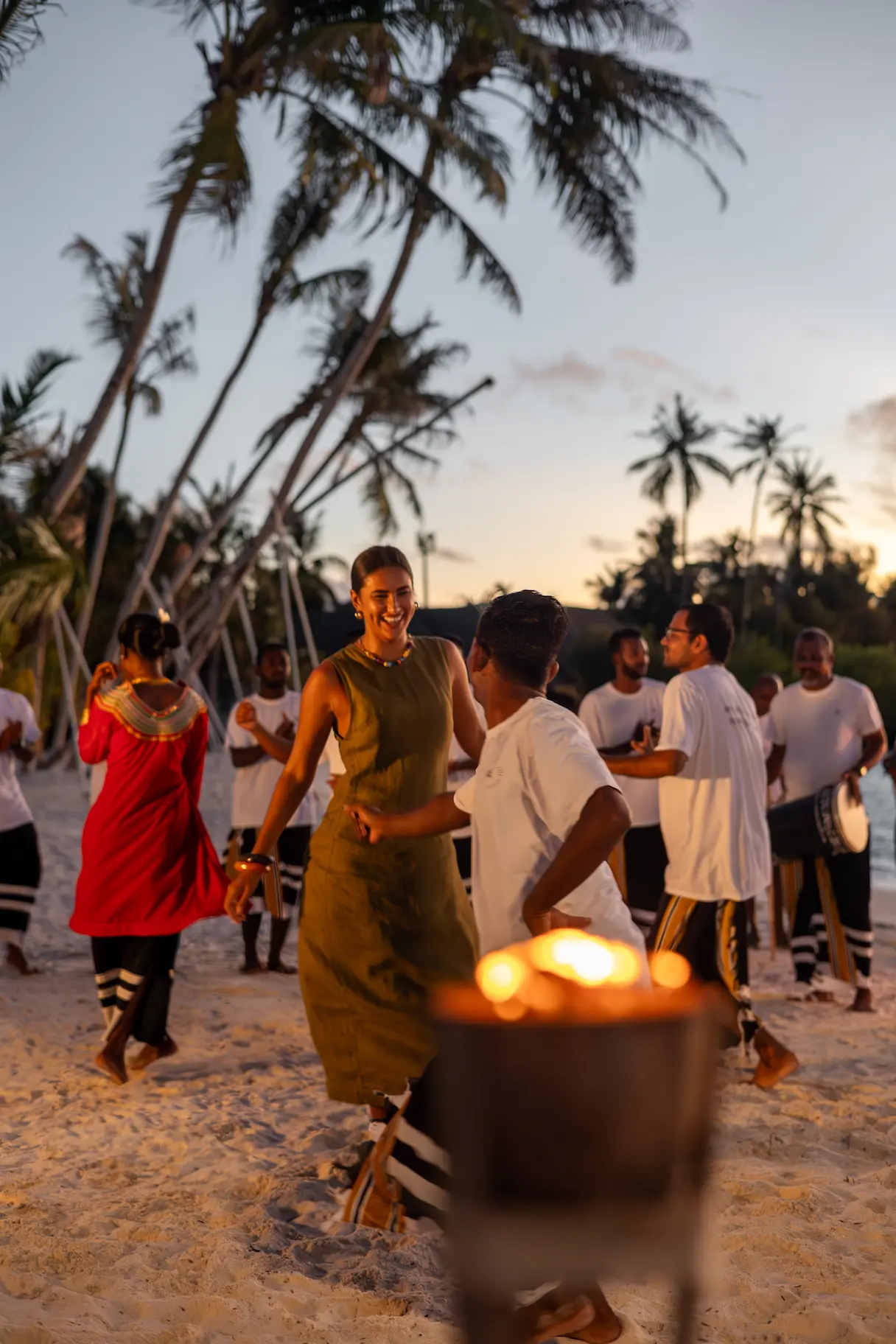 sun siyam iru veli maldives bodu beru night showcasing a vibrant cultural evening with traditional drumming and island celebration atmosphere