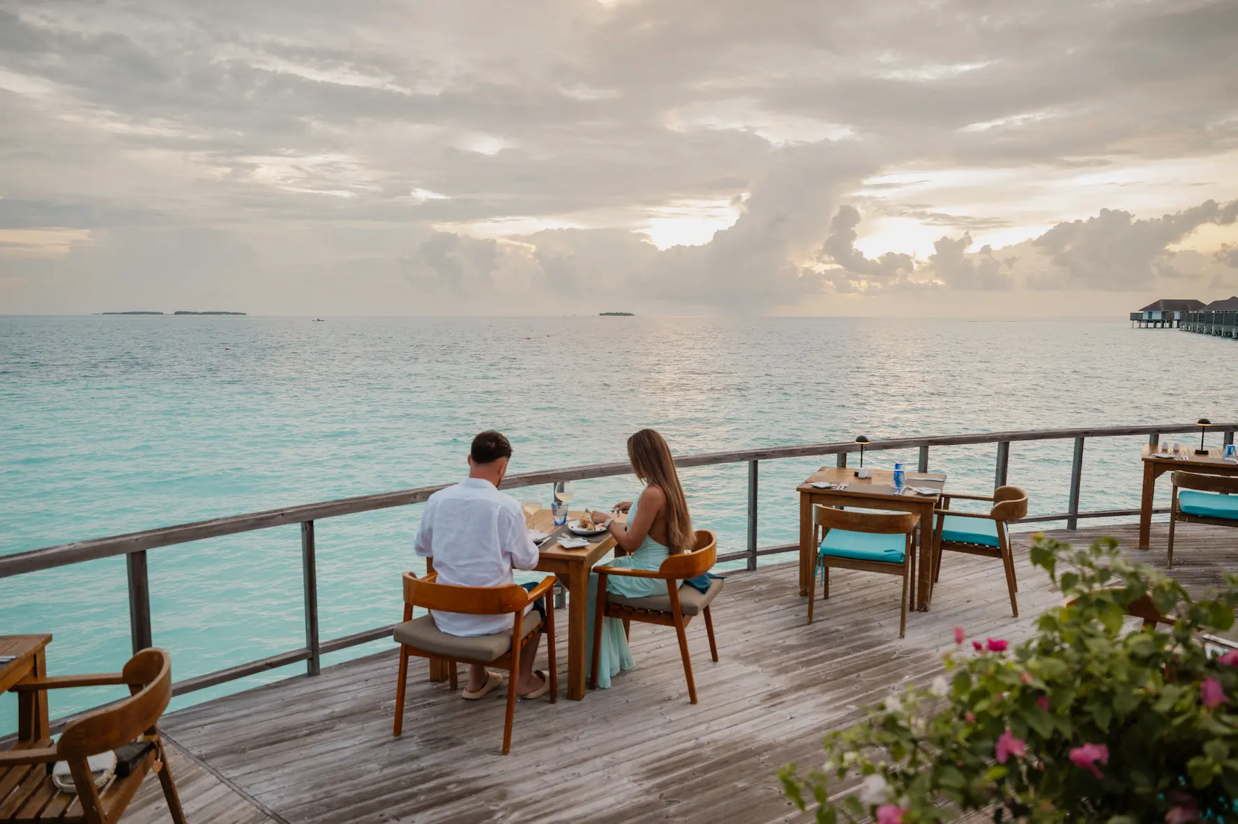 sun siyam iru veli maldives dinner terrace set above the lagoon for open air evening dining