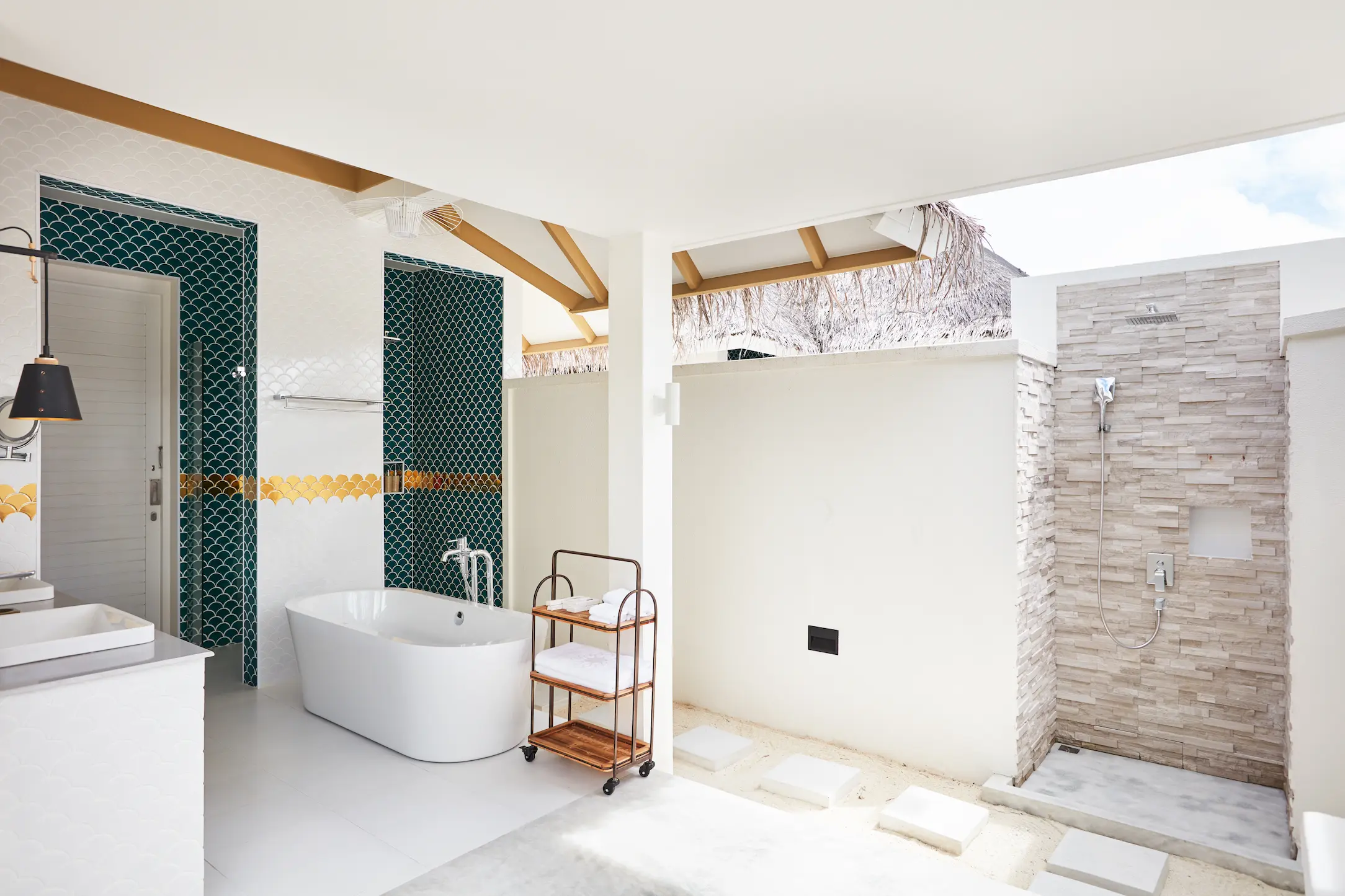 sun siyam iru veli maldives family beach villa with pool bathroom featuring spacious layout natural stone finishes and open air island design