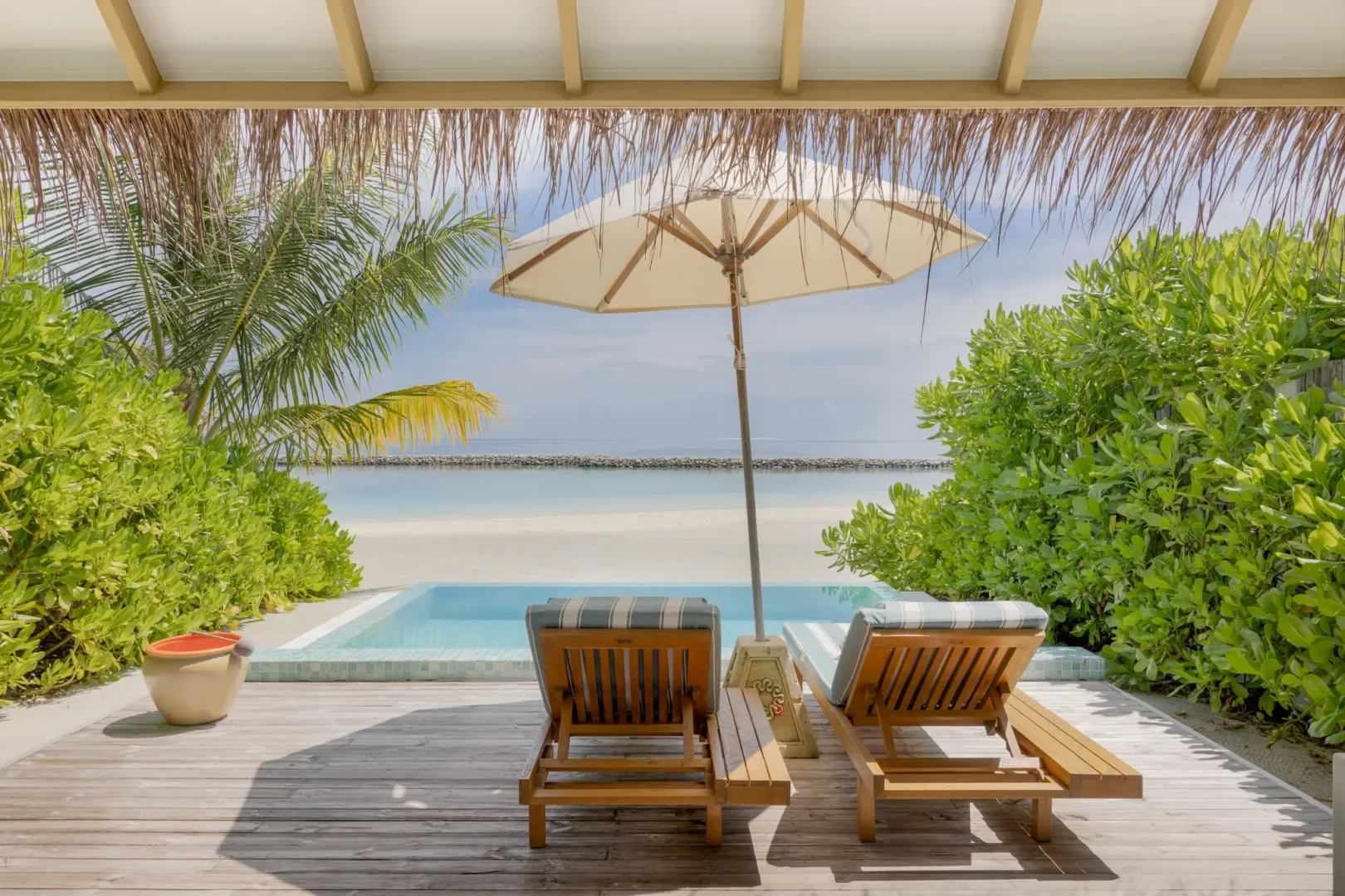 sun siyam iru veli maldives family beach villa with pool terrace featuring outdoor seating private pool and relaxed beachfront living