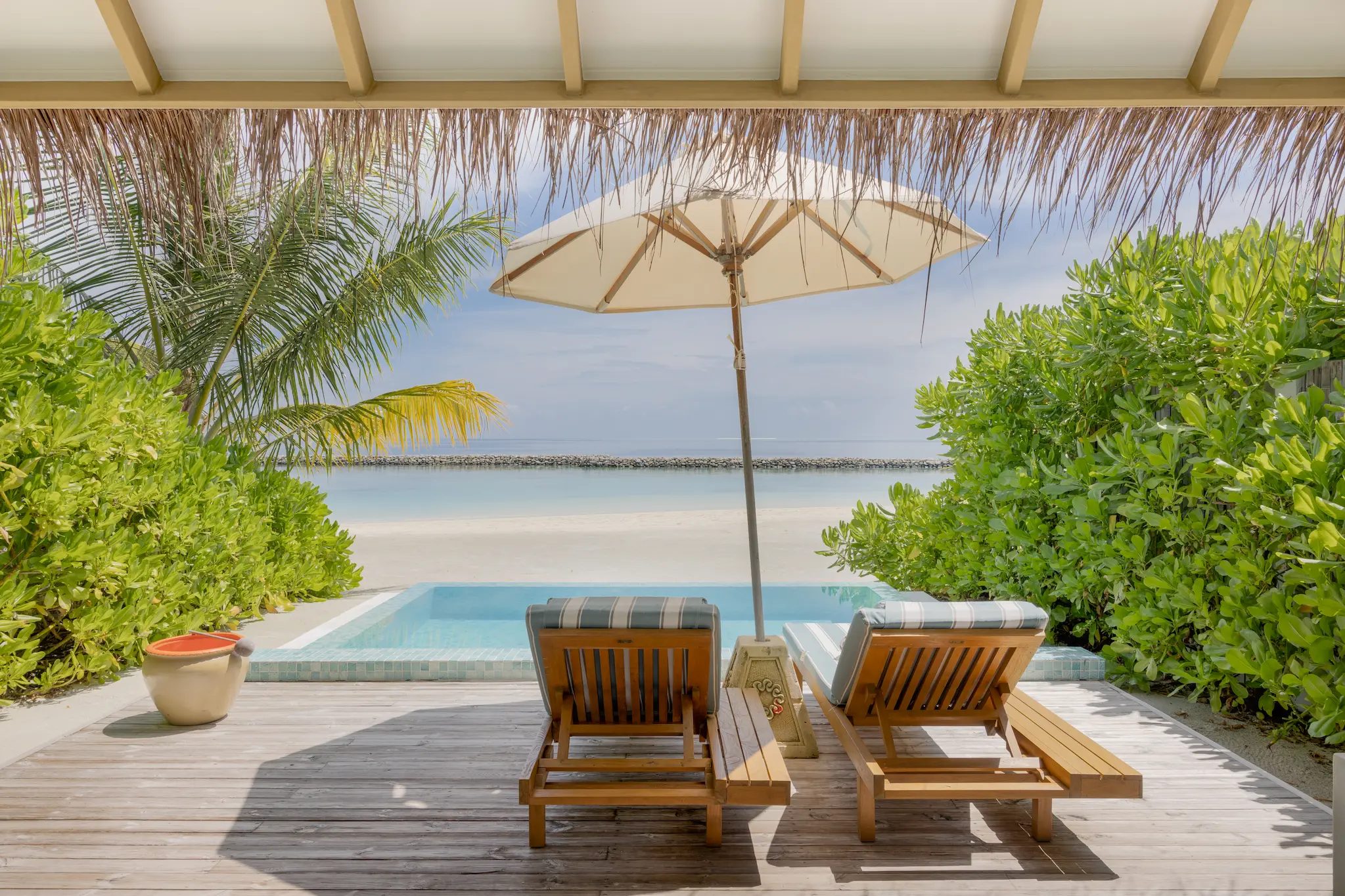 sun siyam iru veli maldives family beach villa with pool terrace featuring outdoor seating private pool and relaxed beachfront living