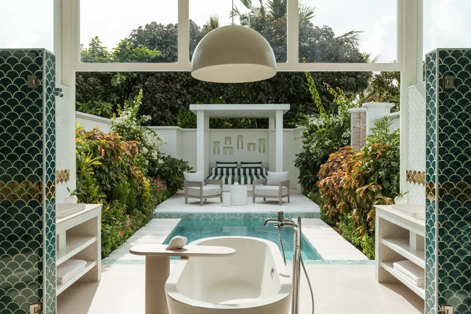 sun siyam iru veli maldives grand beach villa with pool bathroom featuring spacious open air layout natural stone finishes and refined island design