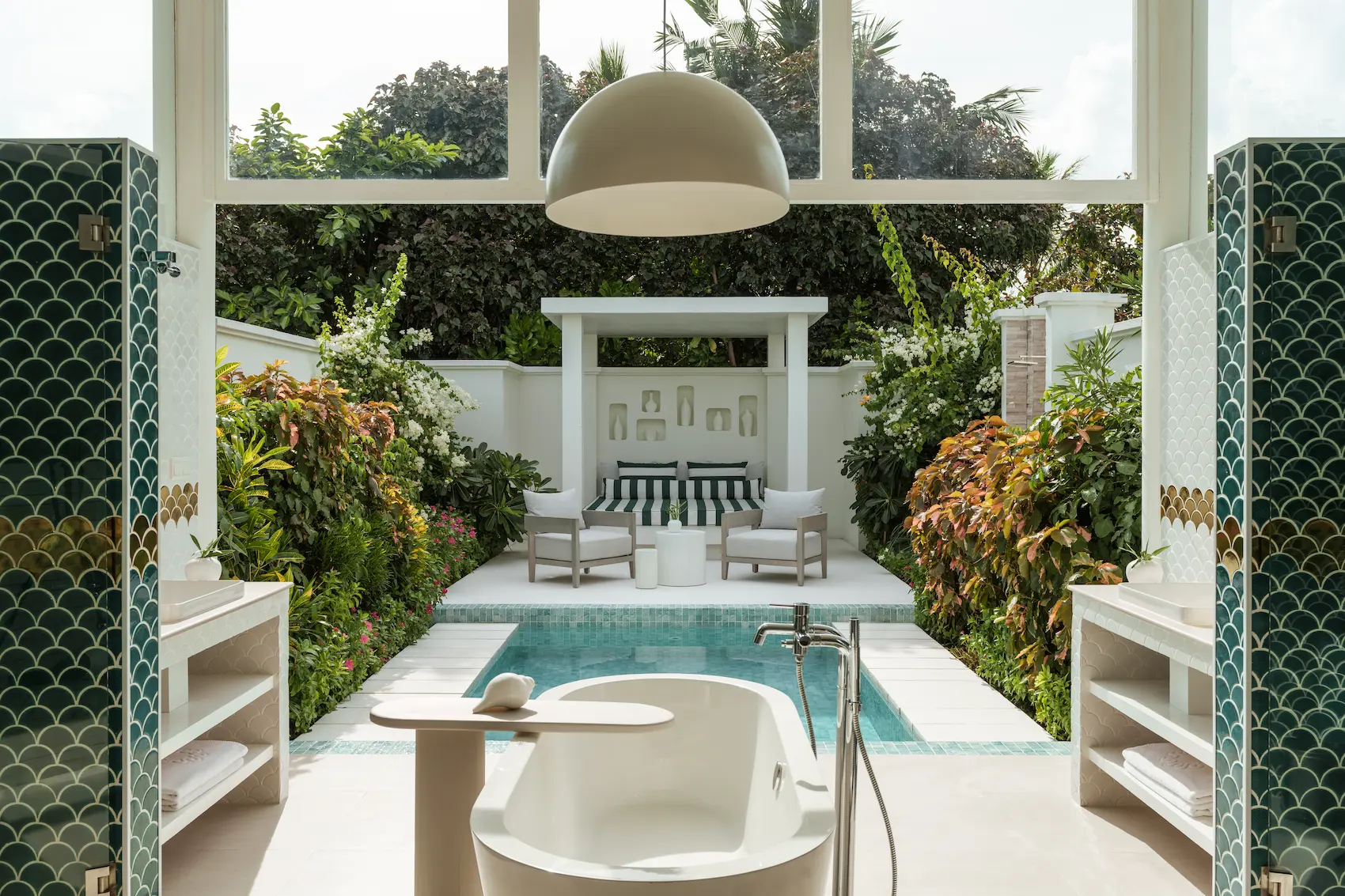 sun siyam iru veli maldives grand beach villa with pool bathroom featuring spacious open air layout natural stone finishes and refined island design