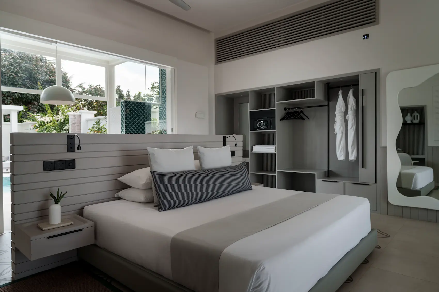 sun siyam iru veli maldives grand beach villa with pool bedroom featuring elegant sleeping space soft furnishings and serene island ambience