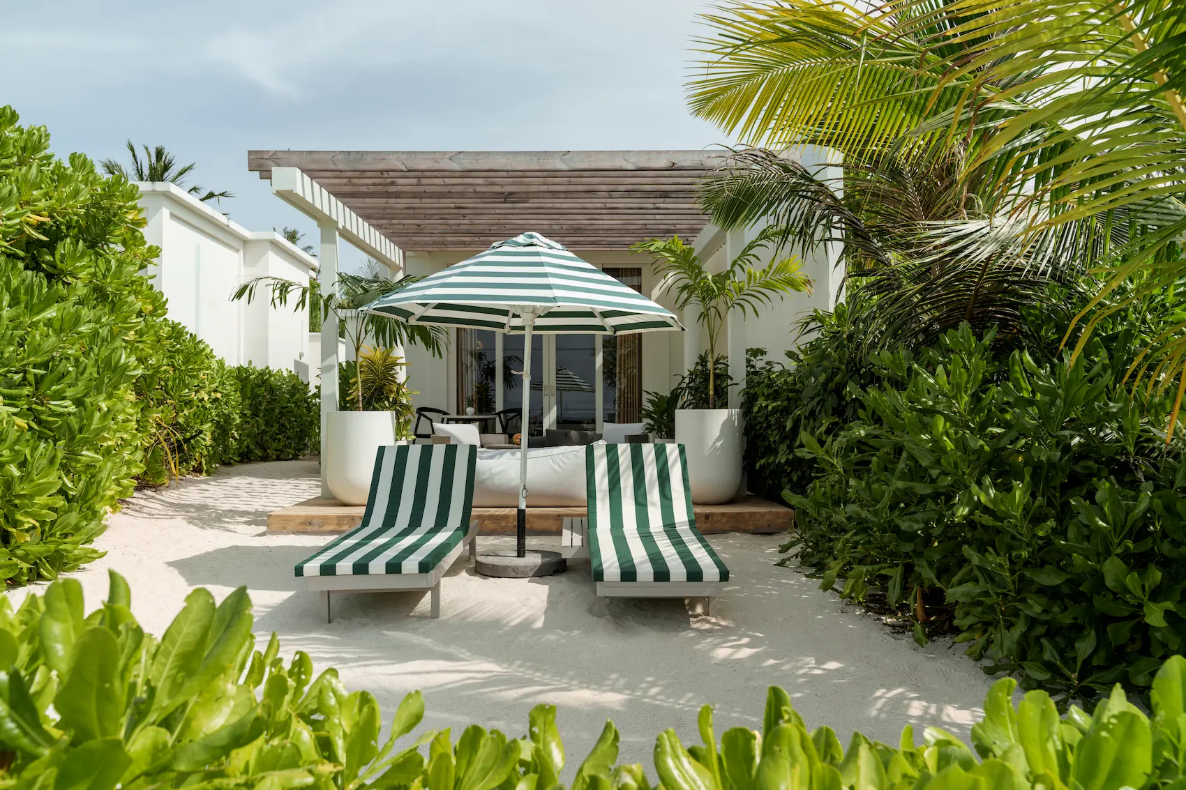 sun siyam iru veli maldives grand beach villa with pool exterior showcasing private villa layout lush tropical greenery and beachfront setting