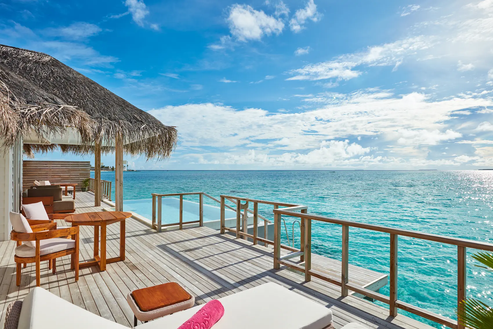 sun siyam iru veli maldives two bedroom ocean residence with pool terrace featuring an expansive outdoor deck overlooking the ocean