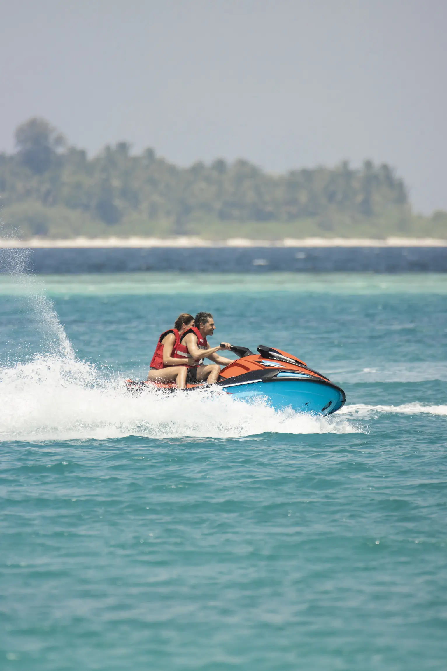 sun siyam iru veli maldives watersports showcasing exciting ocean activities with clear blue waters and an adventurous island atmosphere