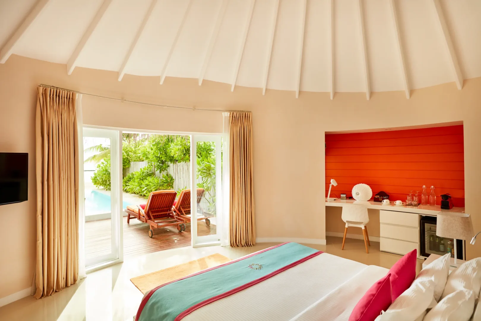 sun siyam vilu reef maldives beach villa with pool bed view opening onto a private terrace with tropical surroundings