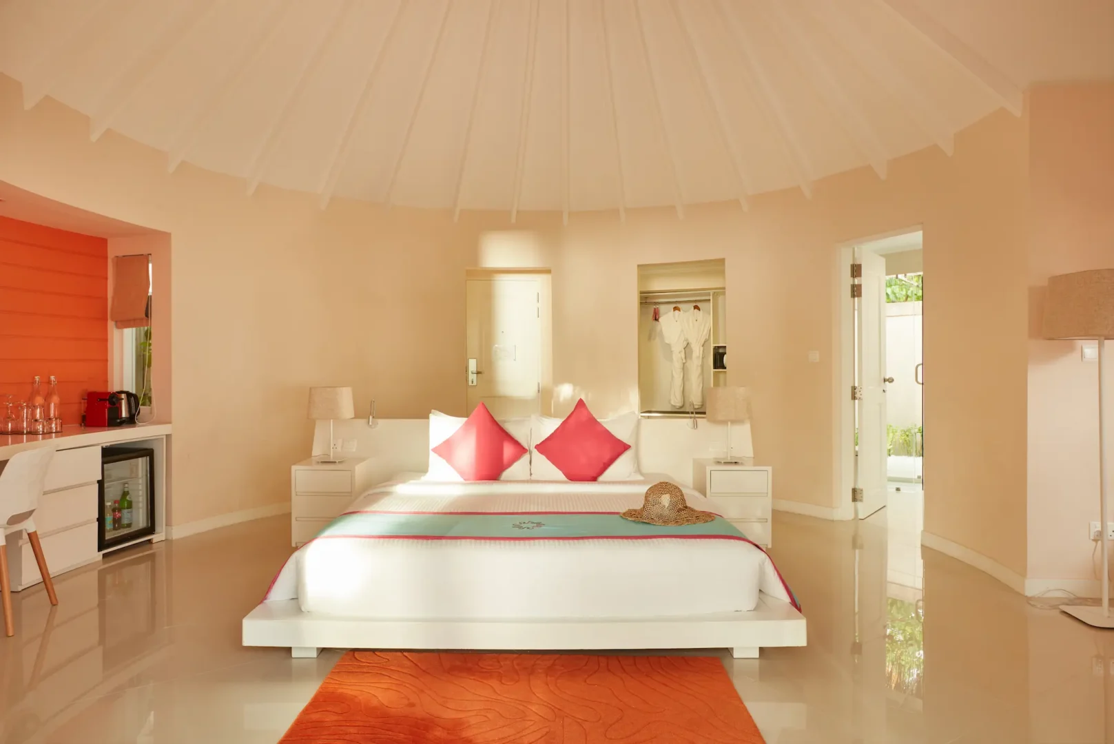 sun siyam vilu reef maldives deluxe beach villa bed styled in refined interiors with soft natural light and a calm tropical ambience