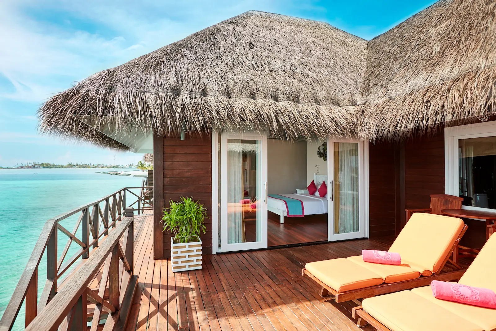sun siyam vilu reef maldives reef villa set above clear turquoise waters with a serene tropical atmosphere