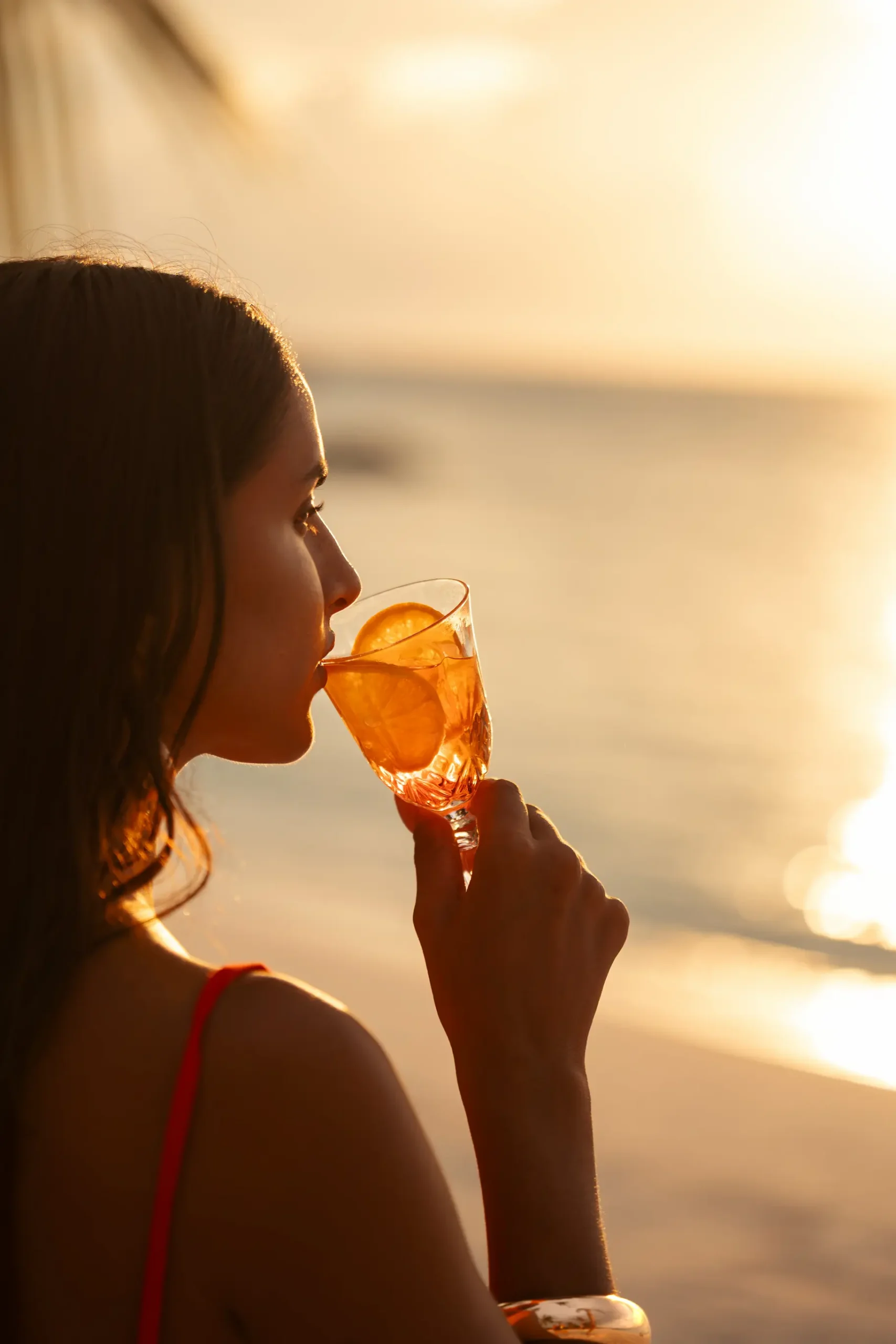 sun siyam vilu reef maldives secret sundowner coconut crew experience set at sunset with a relaxed tropical atmosphere