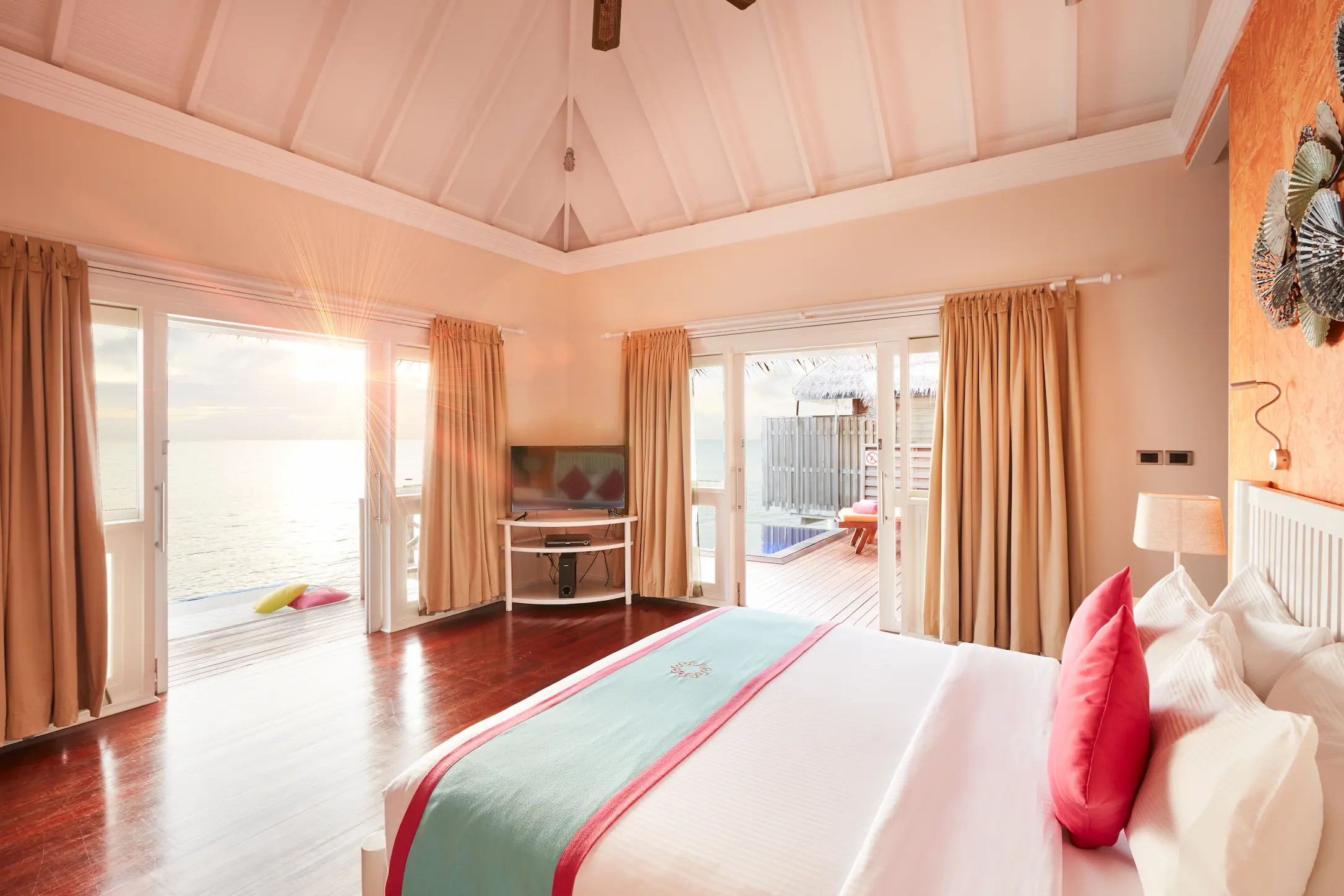 sun siyam vilu reef maldives water villa with pool bed view overlooking the turquoise lagoon and calm ocean surroundings
