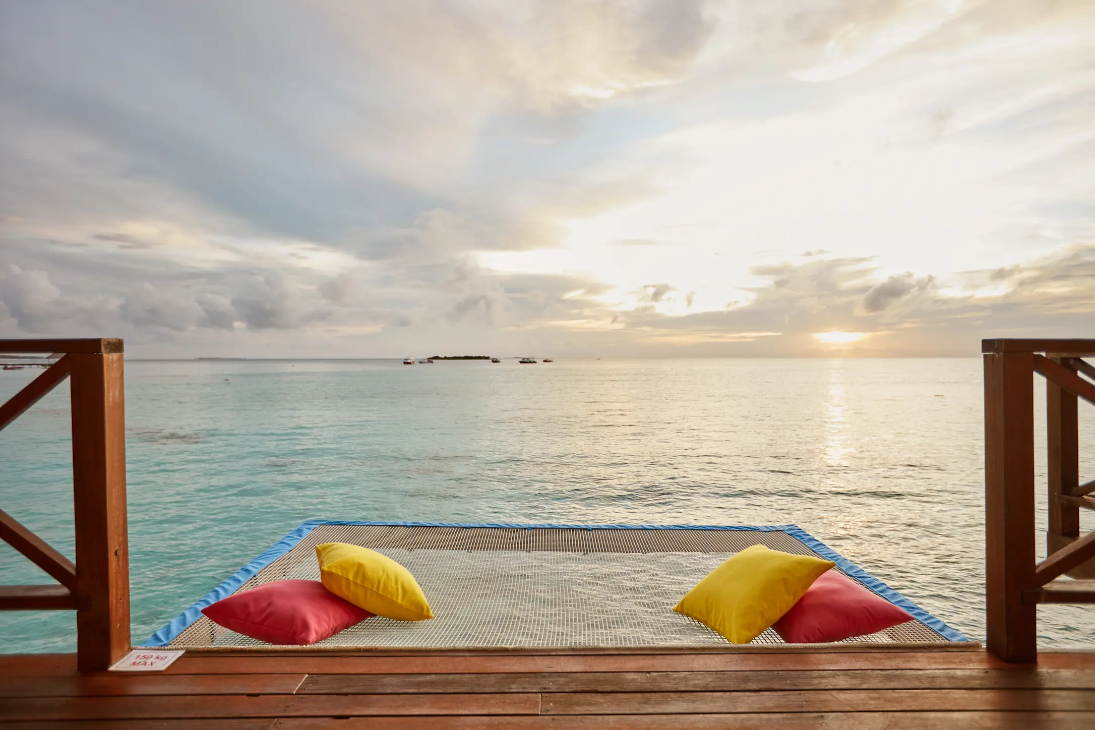 sun siyam vilu reef maldives water villa with pool catamaran net set above the lagoon for relaxed overwater lounging