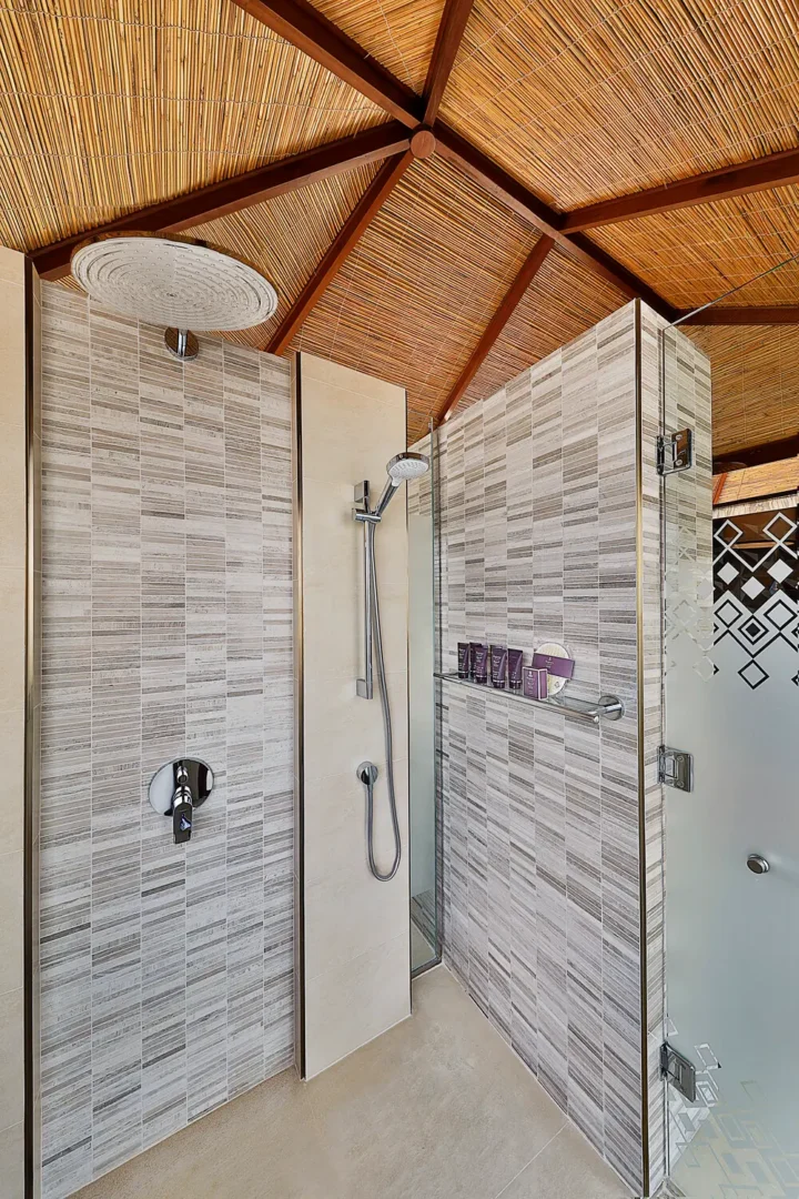 the ritzcarlton al hamra beach al bahar tented villa shower featuring a refined outdoor shower space designed for private coastal living