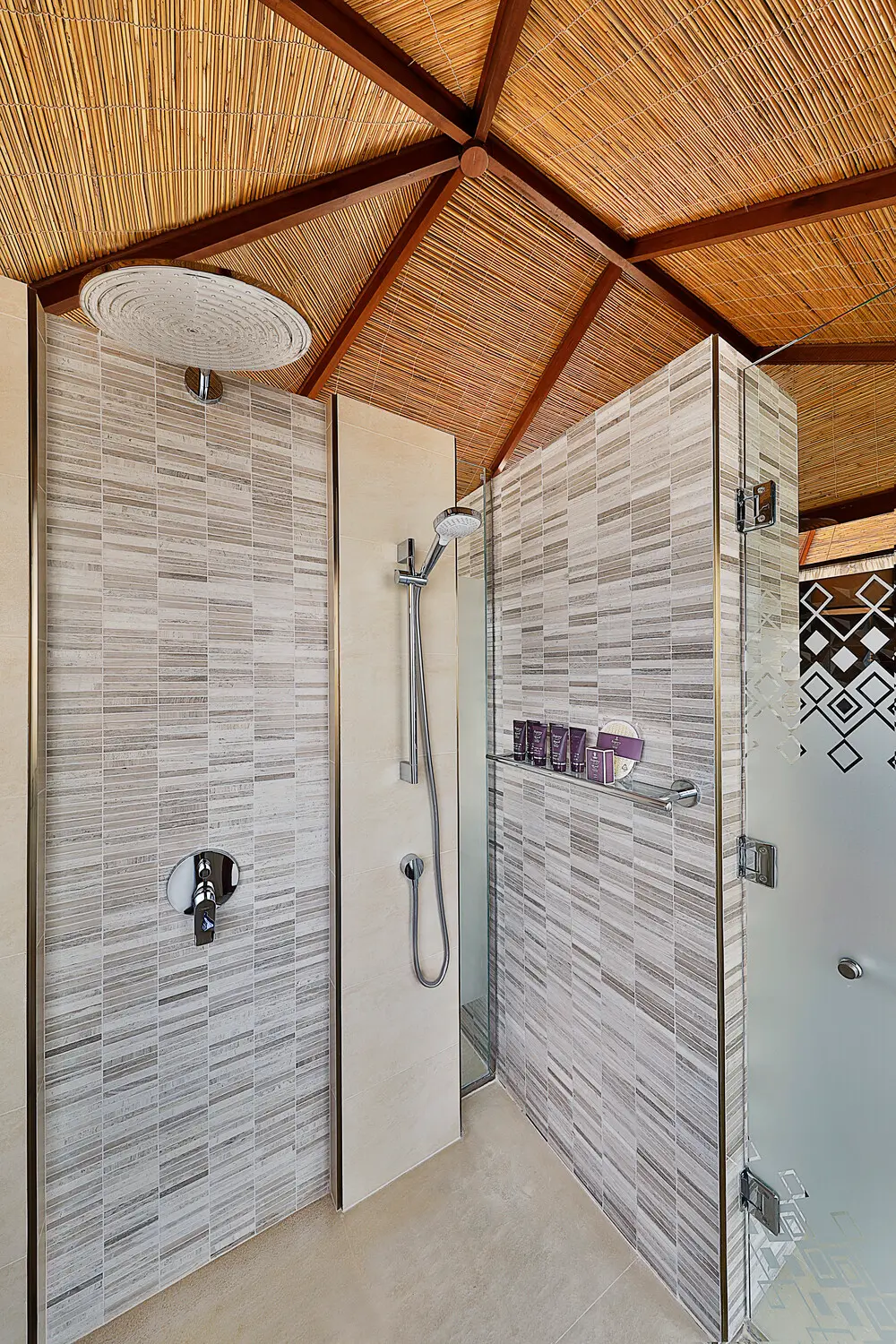 the ritzcarlton al hamra beach al bahar tented villa shower featuring a refined outdoor shower space designed for private coastal living