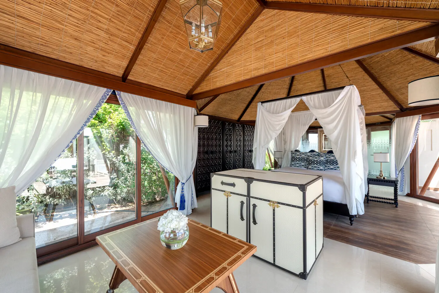 the ritzcarlton al hamra beach al naseem tented villa pool bedroom featuring an elegant bedroom space opening onto a private pool in a coastal setting