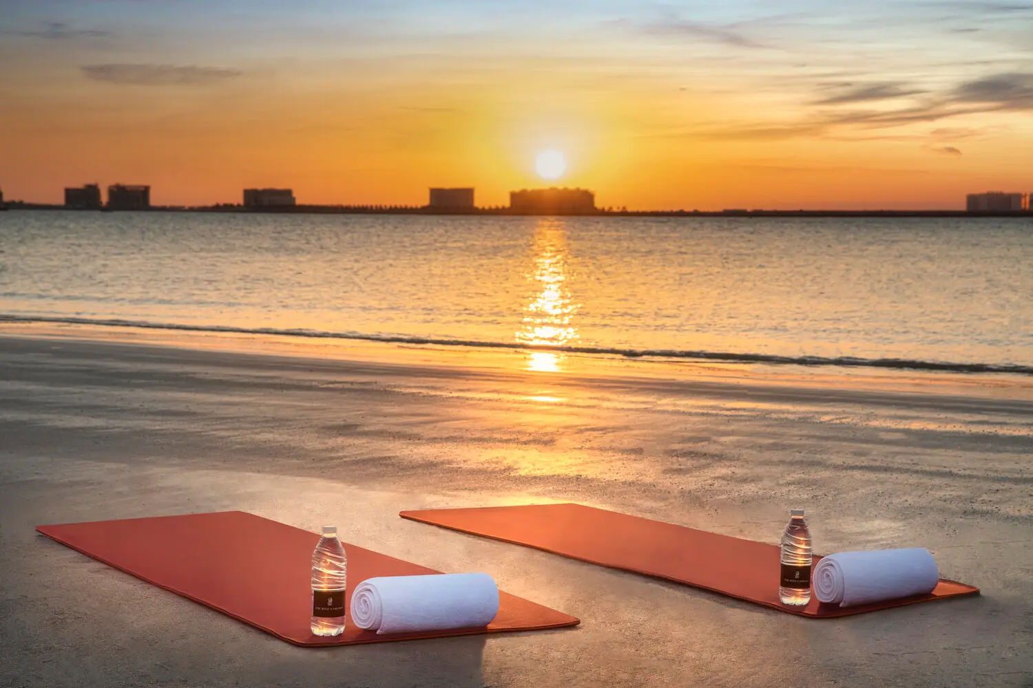 the ritzcarlton al hamra beach beach yoga offering a calming outdoor yoga session set against the serene coastal backdrop