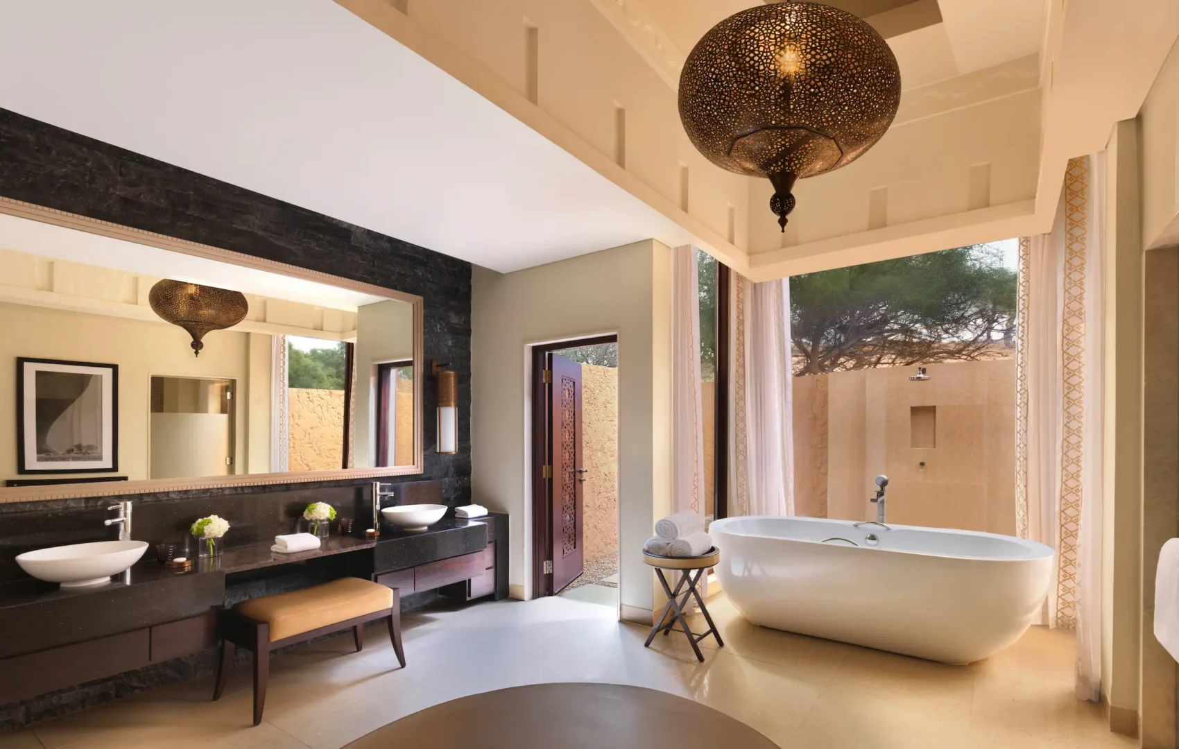 the ritzcarlton al wadi desert al rimal villa bathroom with a spacious soaking tub and refined desert villa design