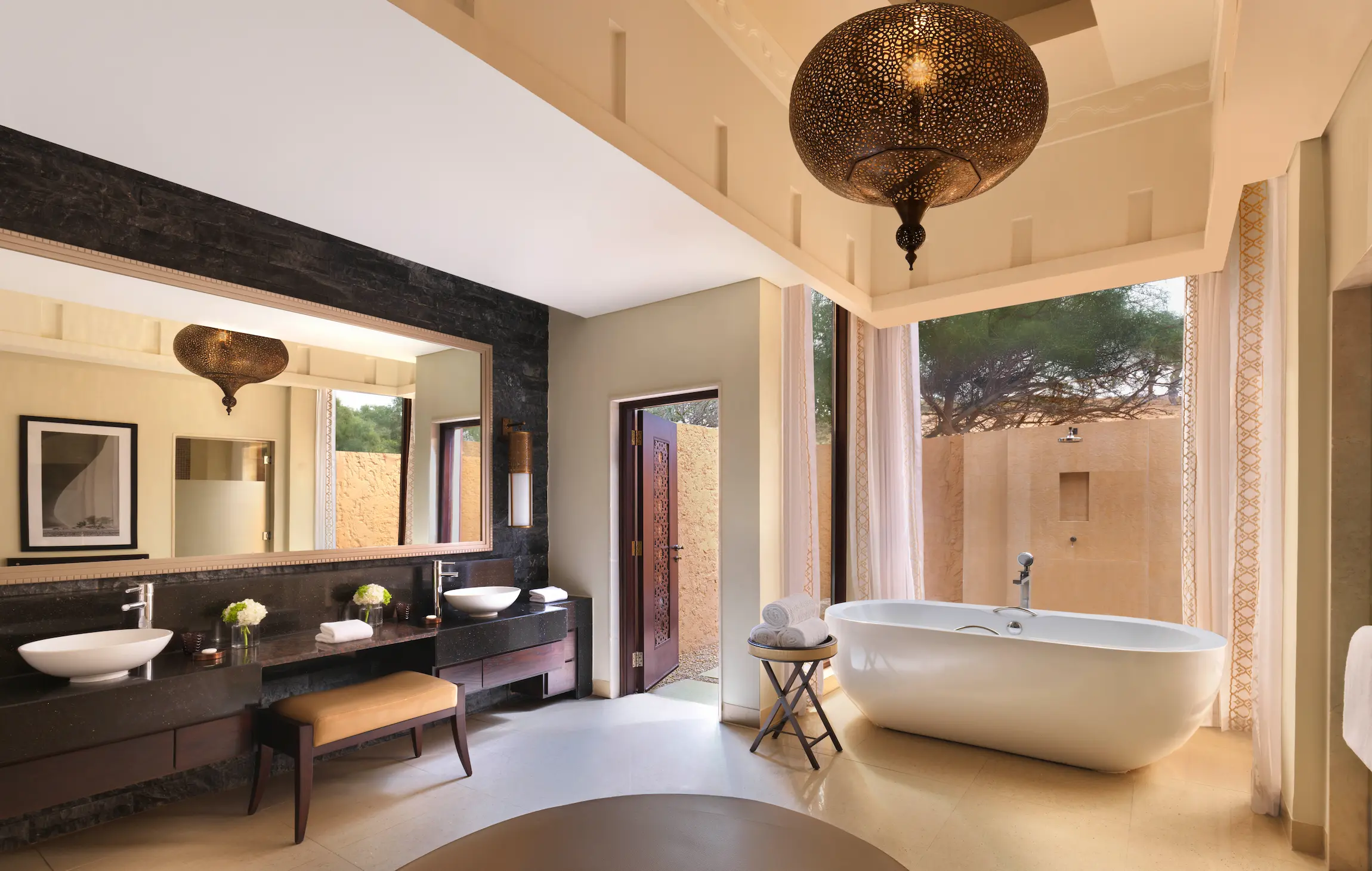 the ritzcarlton al wadi desert al rimal villa bathroom with a spacious soaking tub and refined desert villa design