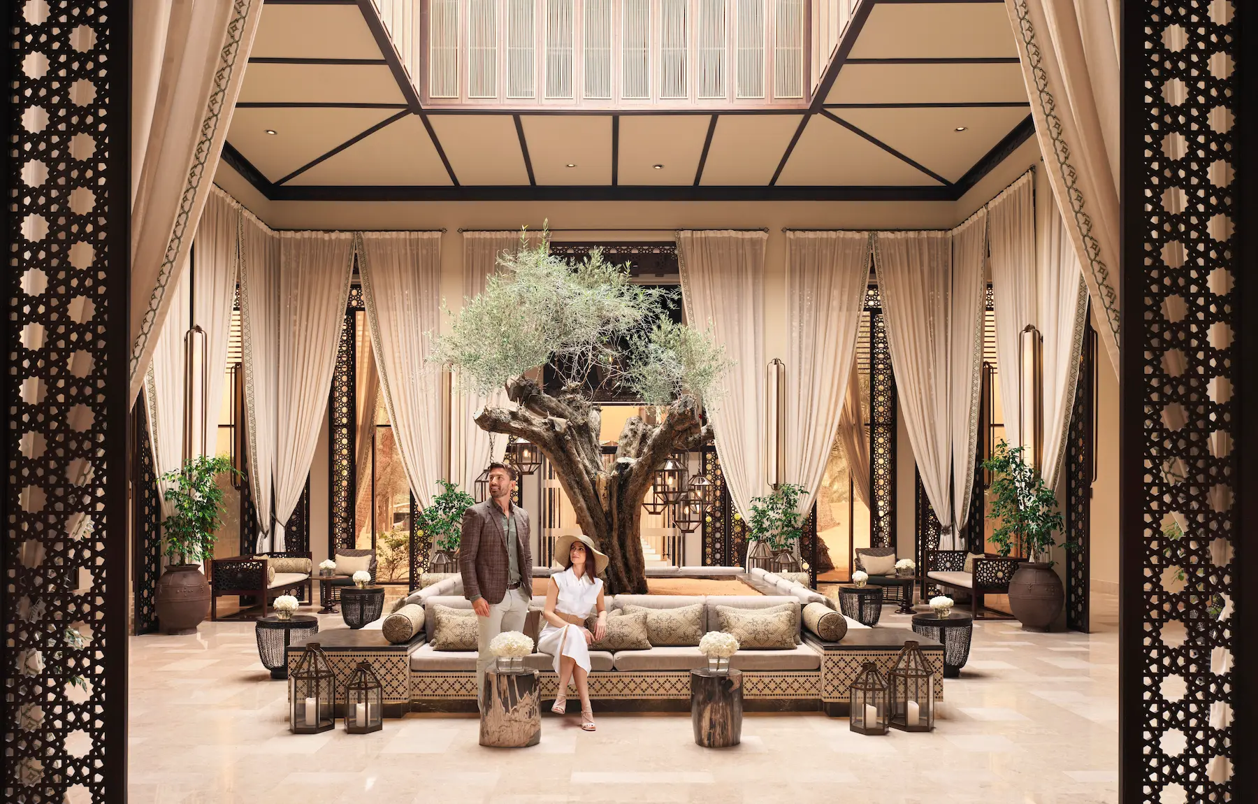 the ritzcarlton al wadi desert reception interior featuring an elegant welcoming space with refined desert inspired design