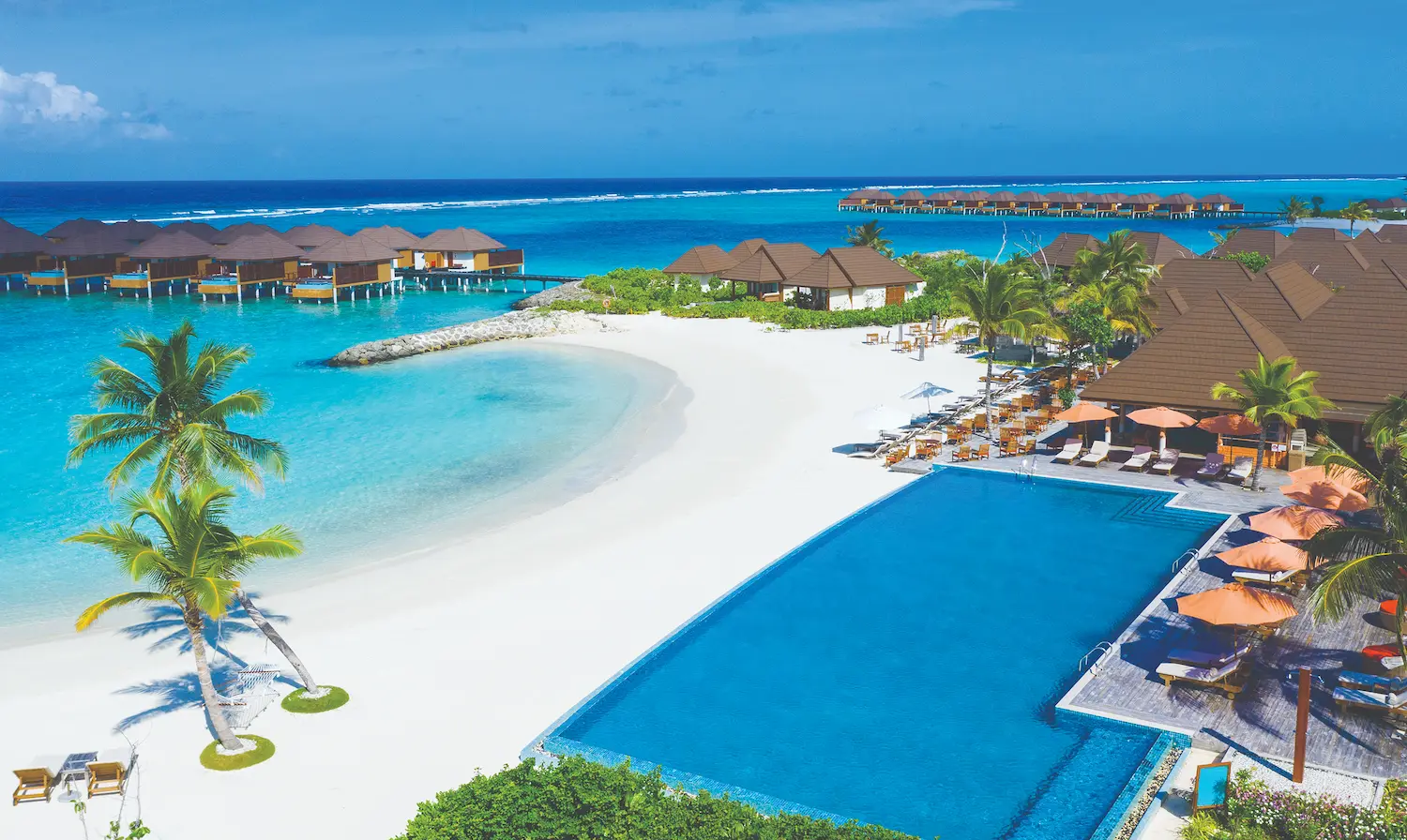 aerial view of bay rouge dining venue at varu by atmosphere maldives set along the tropical shoreline
