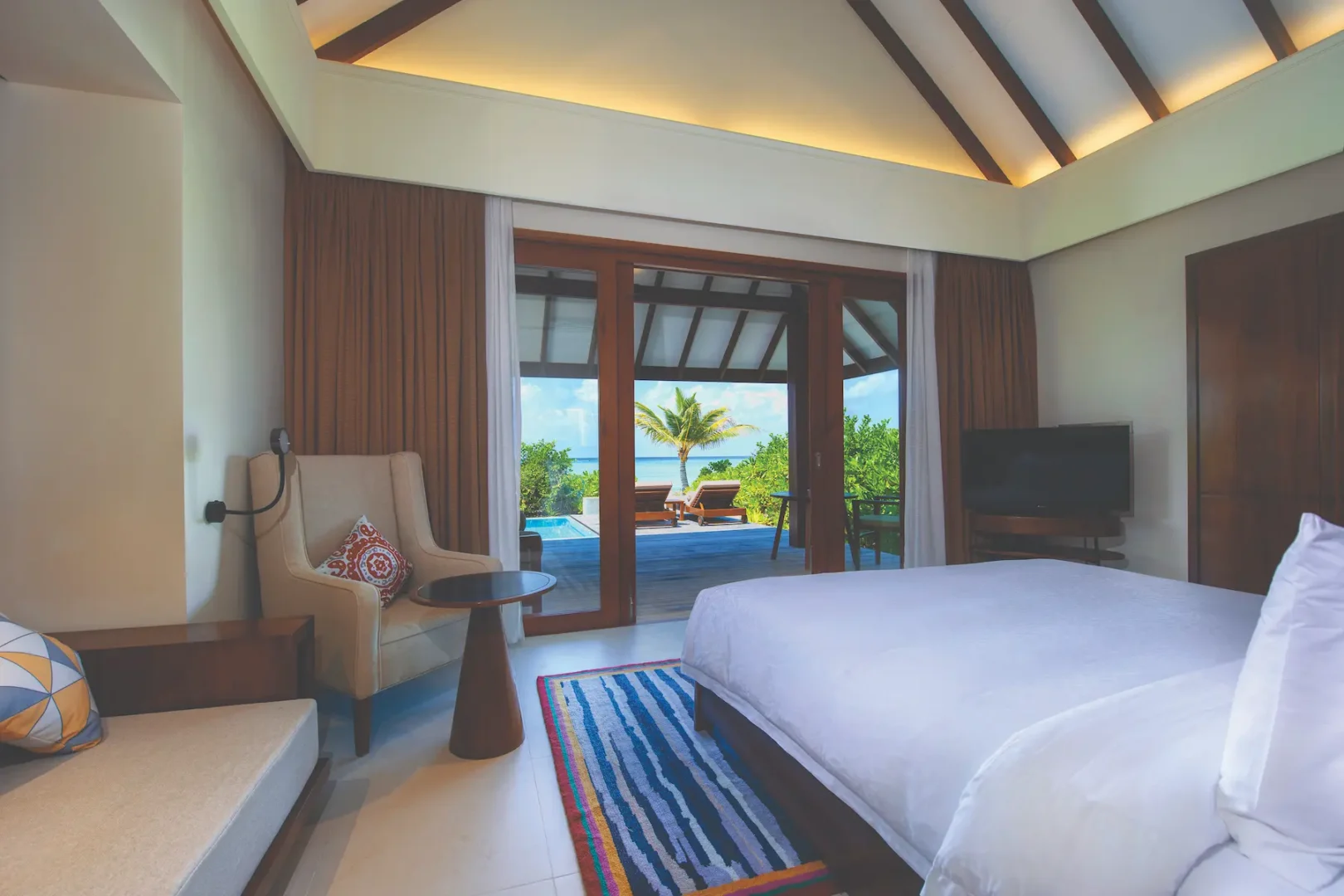 luxury beach villa with private pool bedroom view at varu by atmosphere maldives