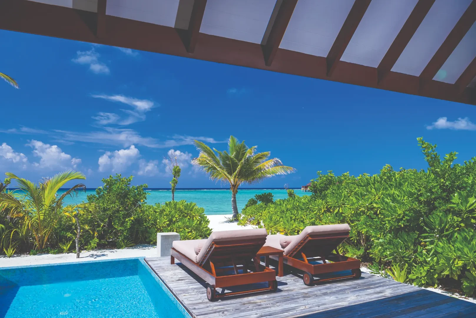 luxury beach villa with private pool deck view at varu by atmosphere maldives