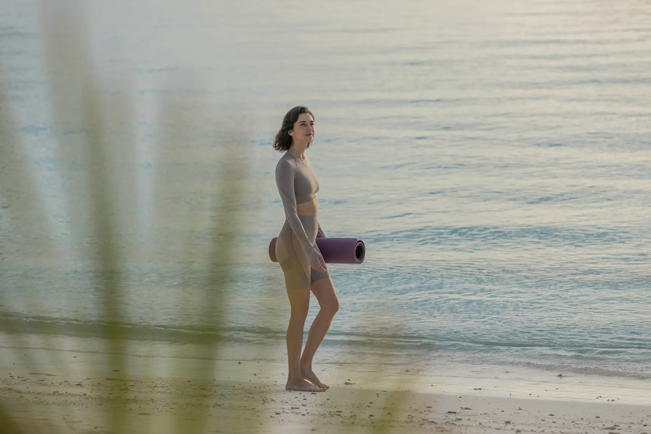 beach yoga session at varu by atmosphere maldives set by the ocean for mindful relaxation