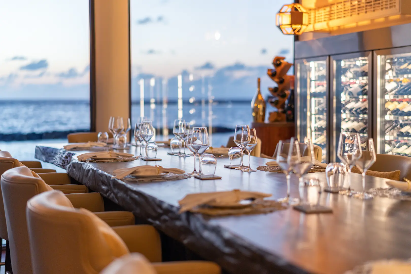 interior of cellar at nu wine and dining venue at varu by atmosphere maldives with elegant contemporary design