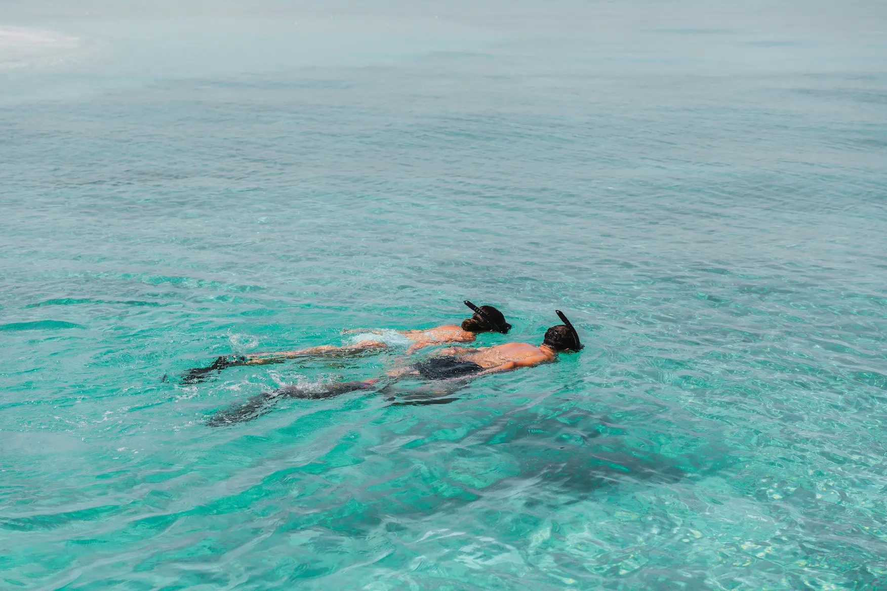sandbank snorkeling excursion at varu by atmosphere maldives surrounded by crystal clear waters and coral reefs