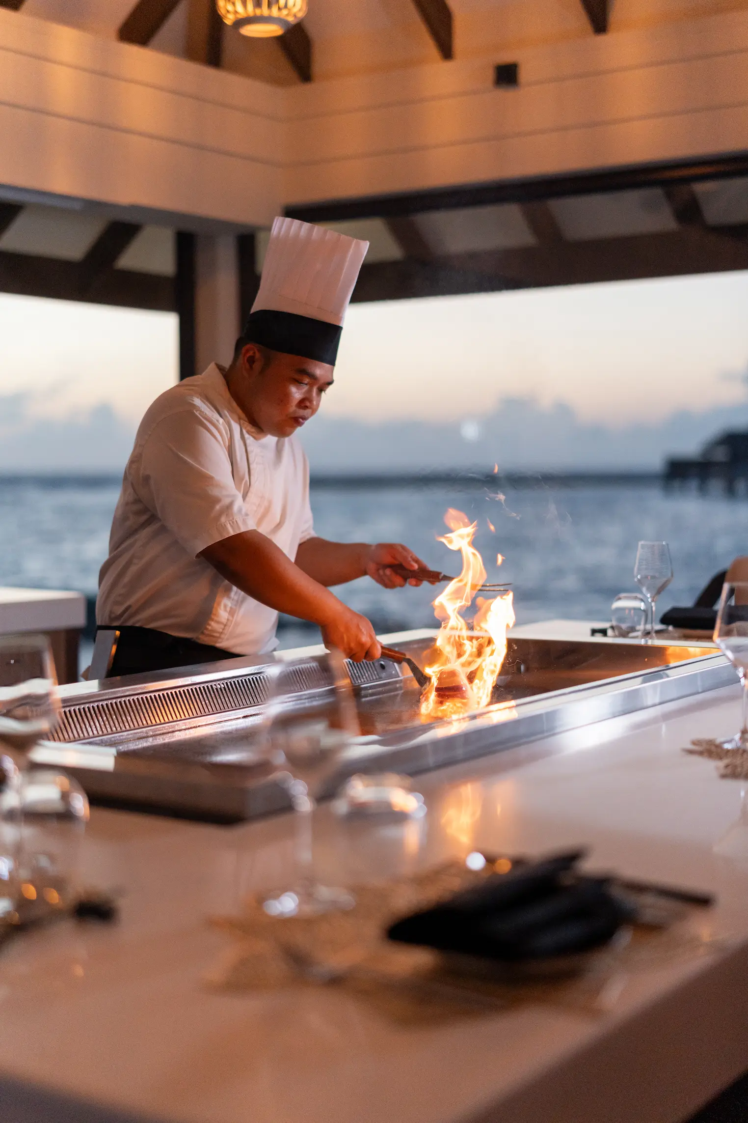 teppanyaki food preparation at varu by atmosphere maldives featuring live cooking and fresh ingredients
