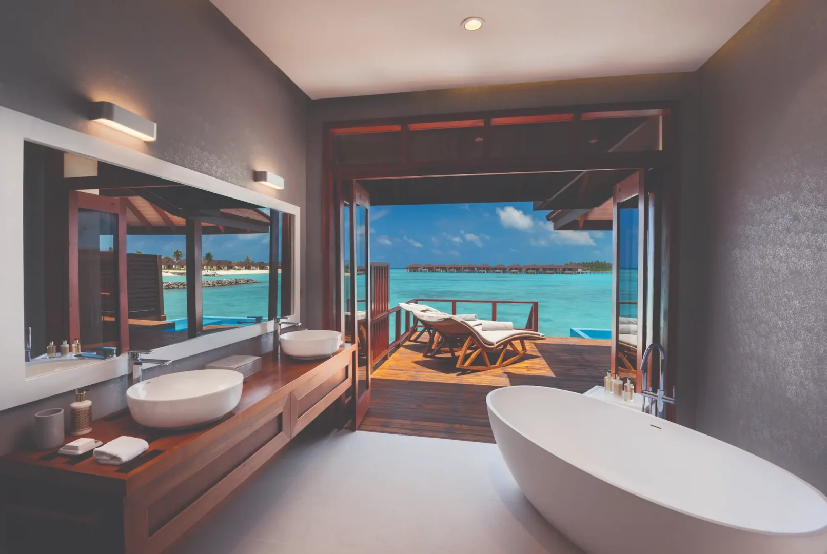 luxury water villa with private pool bathroom view at varu by atmosphere maldives with contemporary design