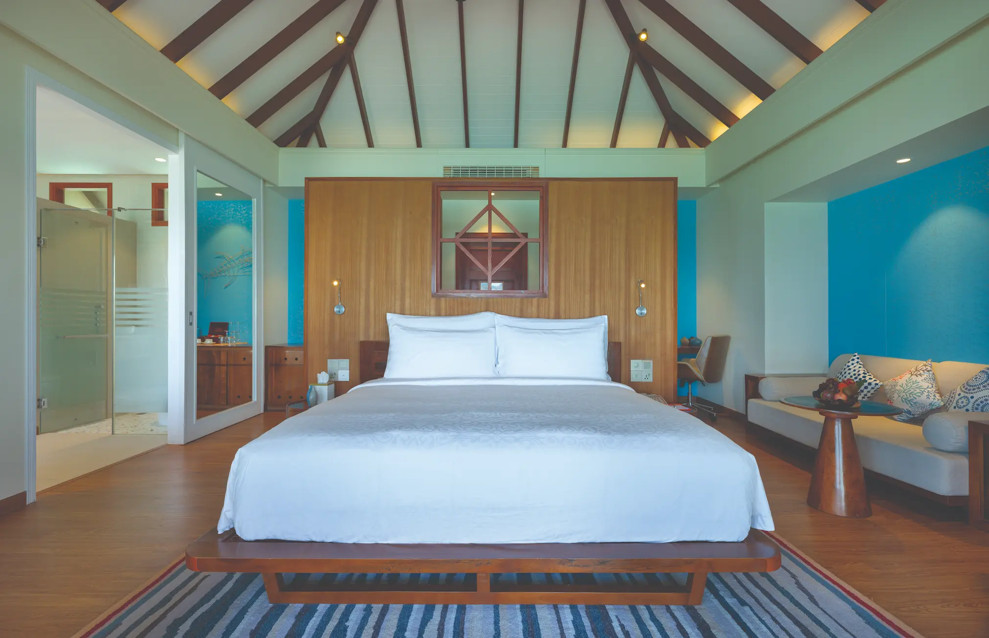 luxury water villa with private pool interior at varu by atmosphere maldives featuring elegant contemporary design