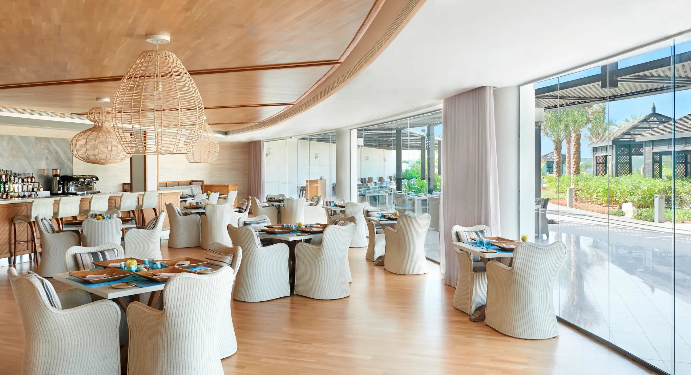 waldorf astoria ras al khaimah azure restaurant offering relaxed mediterranean dining in a stylish poolside setting