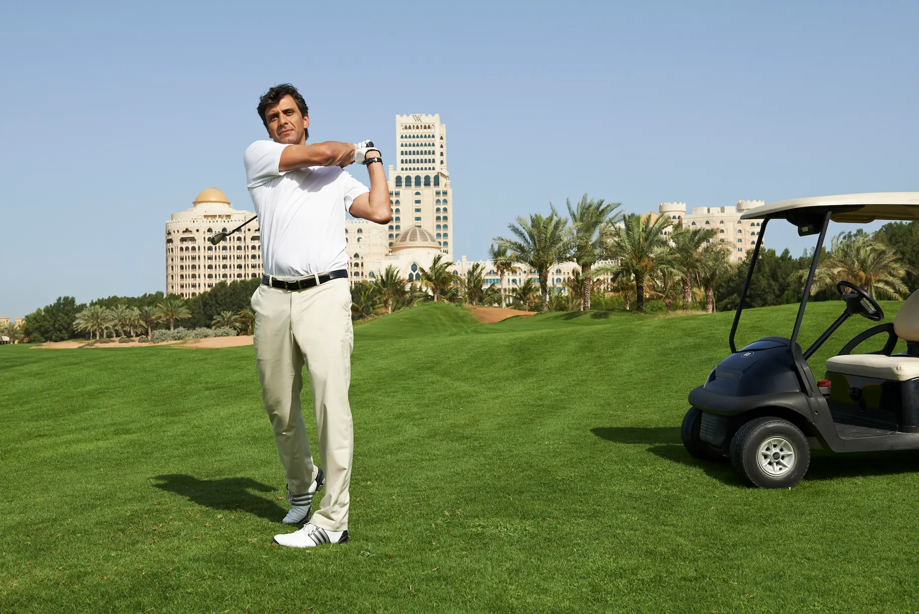 waldorf astoria ras al khaimah golf course lifestyle capturing relaxed leisure moments across manicured fairways