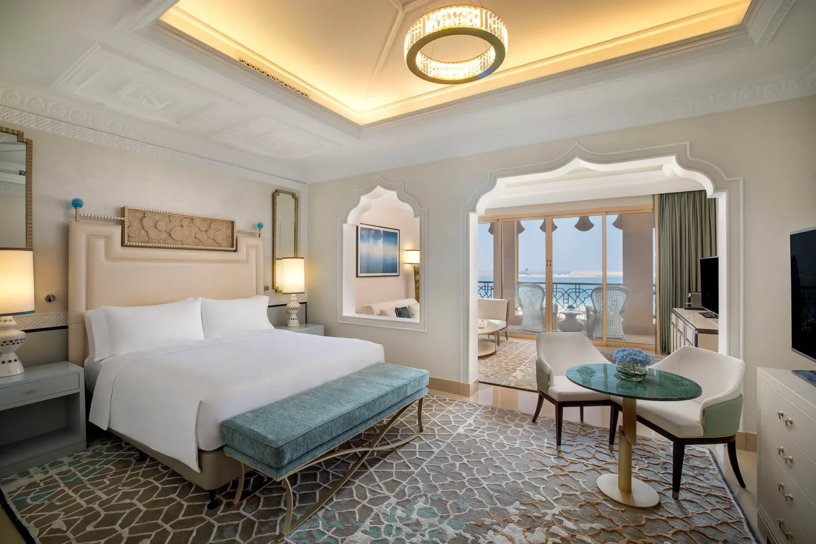 waldorf astoria ras al khaimah king ocean view junior suite bedroom overview with coastal luxury design and sea ambiance