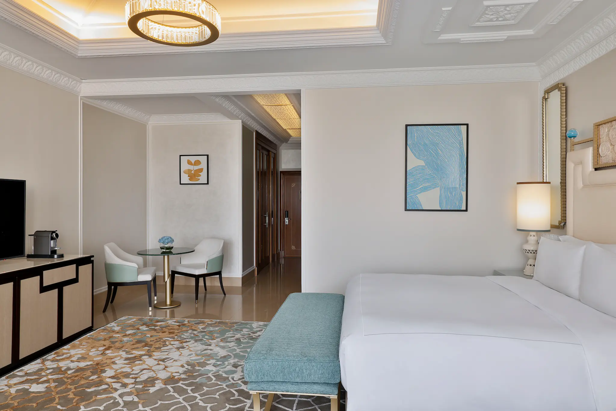 waldorf astoria ras al khaimah king premier golf course view room entrance with elegant arrival space