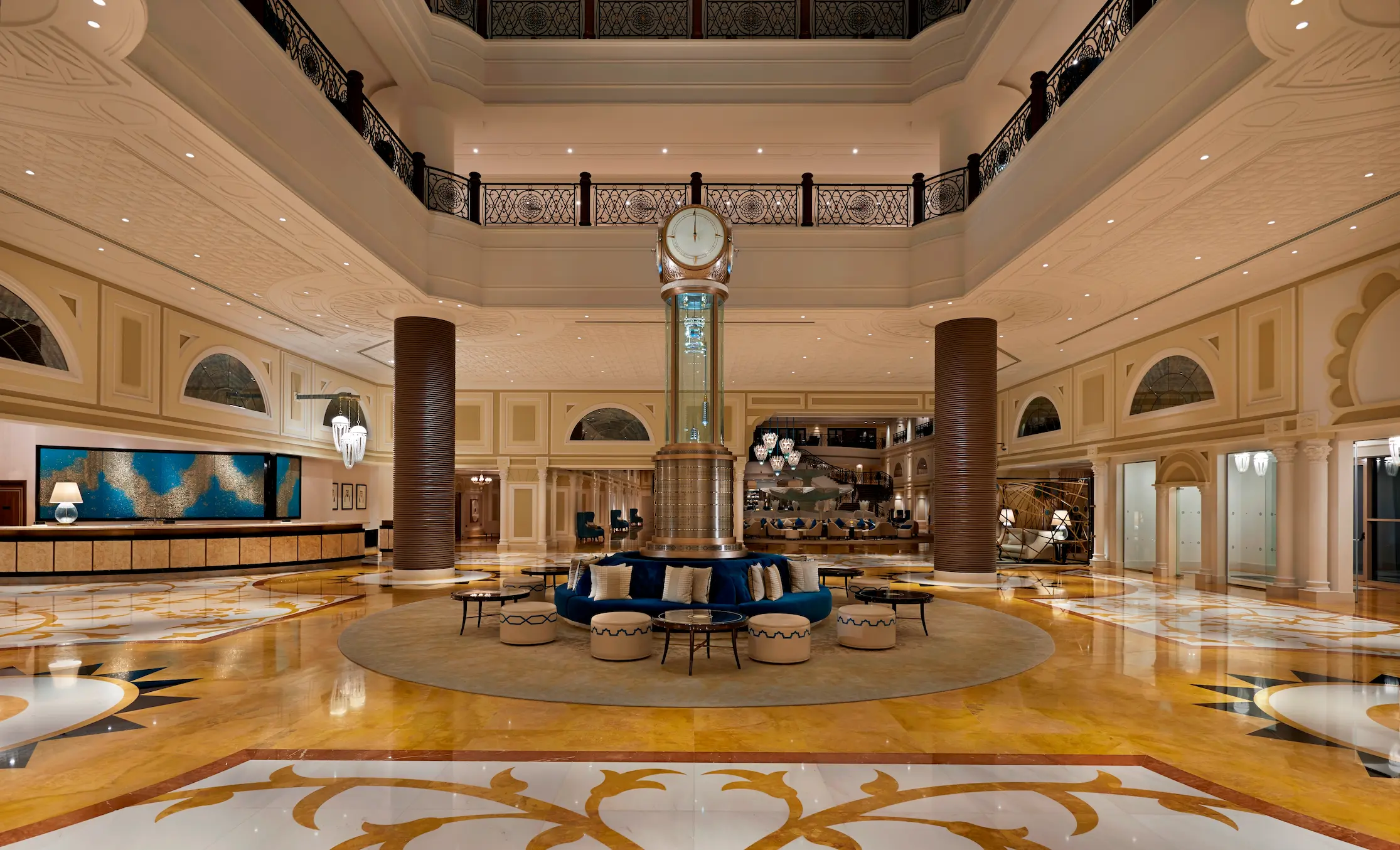 waldorf astoria ras al khaimah lobby concierge offering personalised assistance in an elegant arrival setting