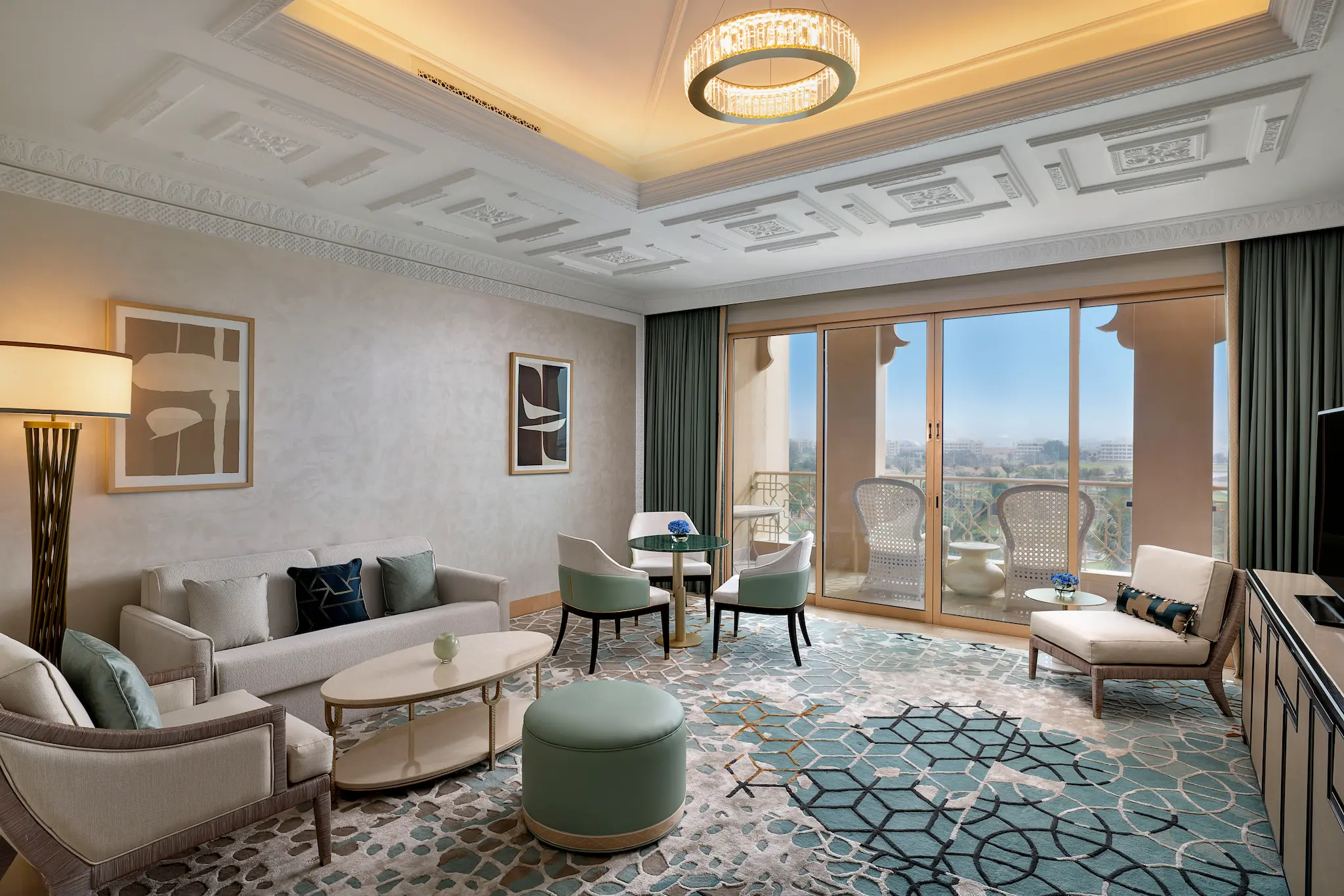 waldorf astoria ras al khaimah one bedroom golf course view suite living room with sofa bed overlooking greens