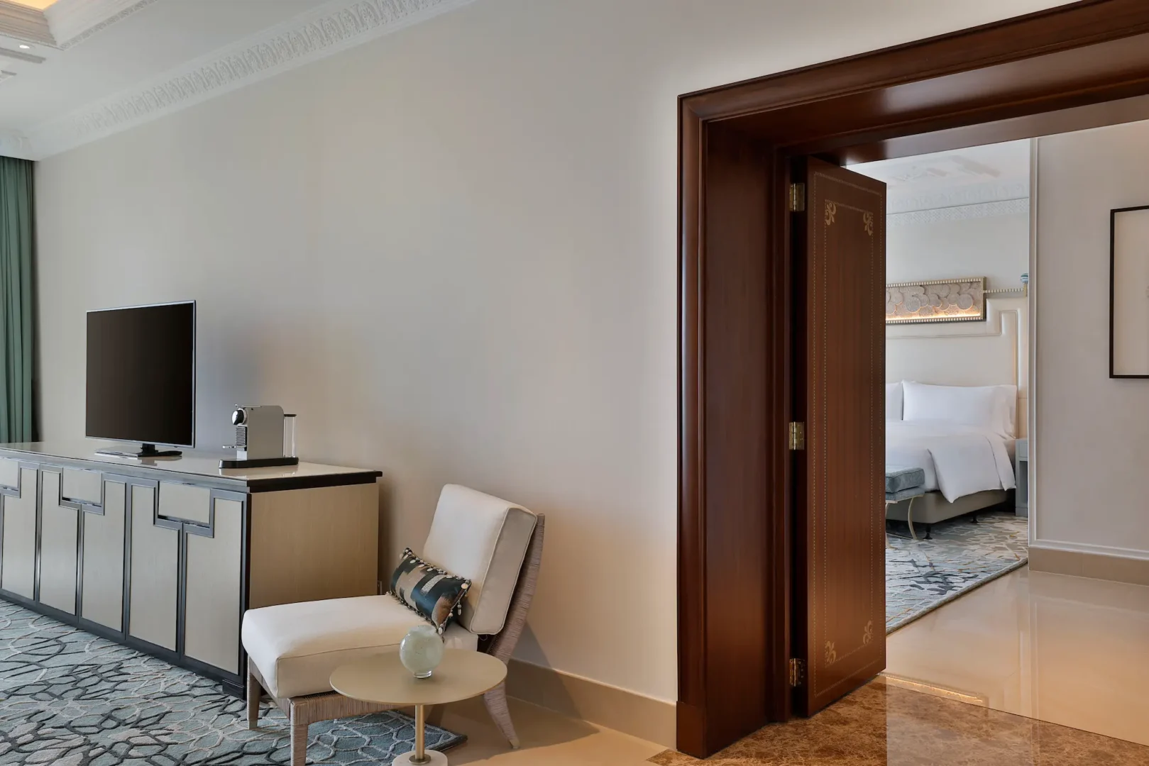 waldorf astoria ras al khaimah one bedroom golf course view suite overview showcasing spacious luxury layout and views of the greens