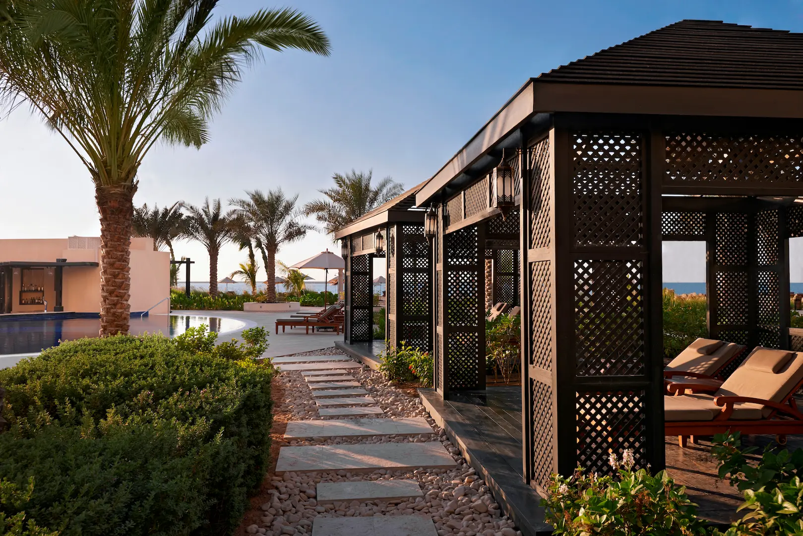 waldorf astoria ras al khaimah poolside cabana offering a private shaded retreat beside the pool
